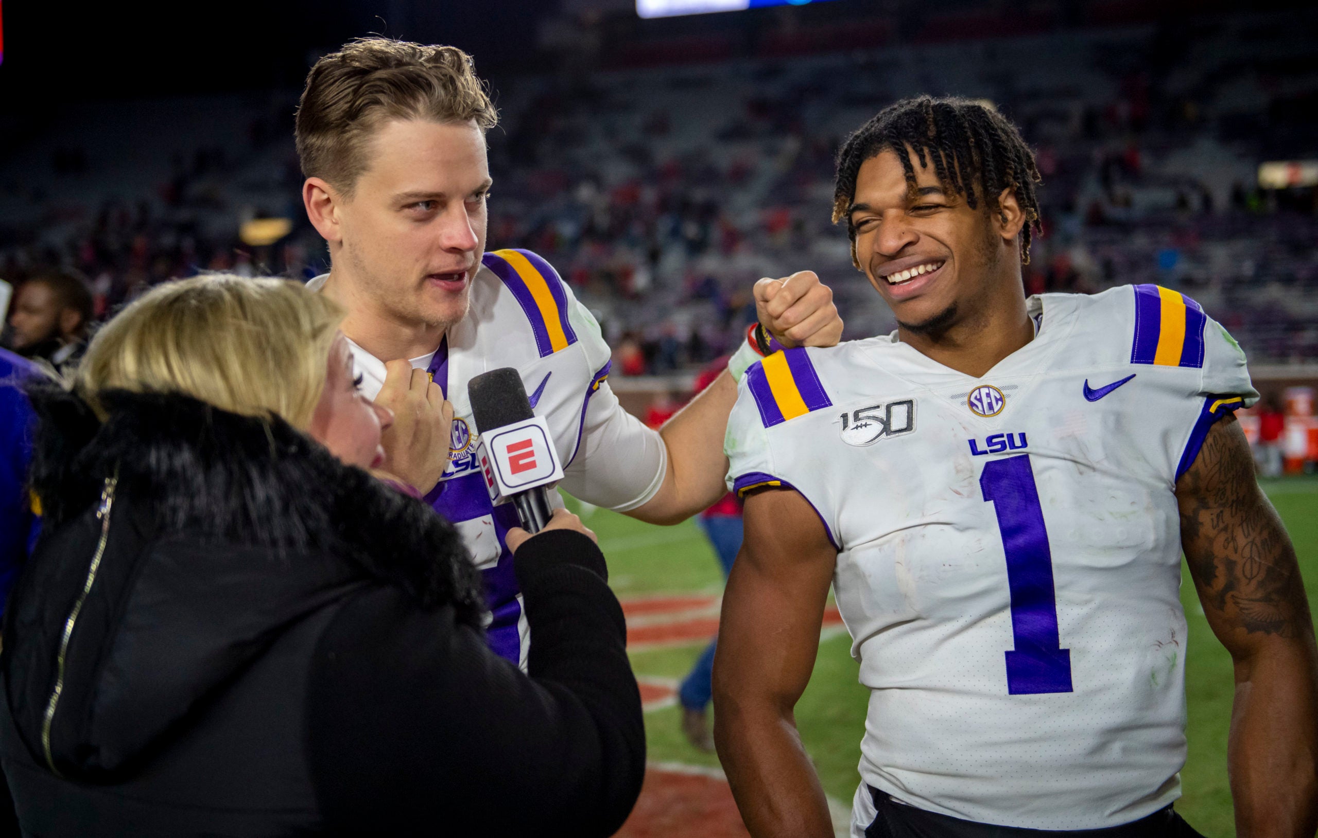 Nov 16, 2019; Oxford, MS, USA; ESPN talks with Louisiana State Tigers quarterback Joe Burrow (9) and wide receiver Ja'Marr Chase (1) after the game against the Mississippi Rebels at Vaught-Hemingway Stadium. Mandatory Credit: Vasha Hunt-USA TODAY Sports