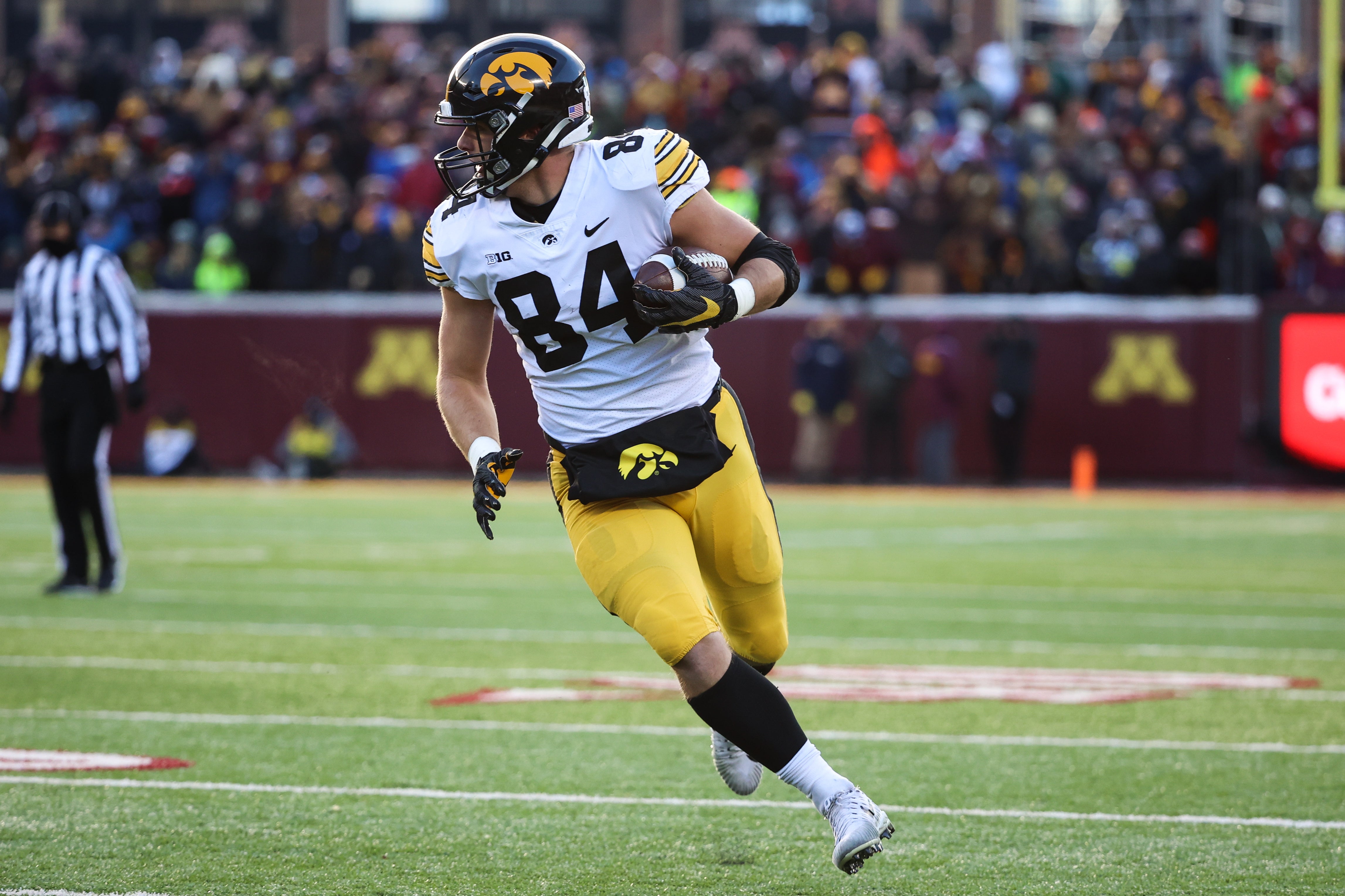 Nov 19, 2022; Minneapolis, Minnesota, USA; Iowa Hawkeyes tight end Sam LaPorta (84) runs with the ball against the Minnesota Golden Gophers during the first quarter at Huntington Bank Stadium. Mandatory Credit: Matt Krohn-USA TODAY Sports