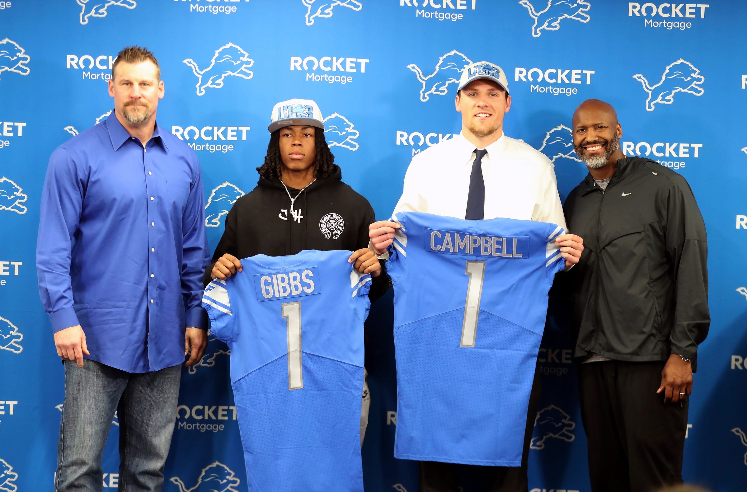Detroit Lions coach Dan Campbell, Jahmyr Gibbs from Alabama, Jack Campbell from Iowa, and general manager Brad Holmes pose during the players' introductory news conference at team headquarters in Allen Park on Friday, April 28, 2023. Lions 042823 Kd275