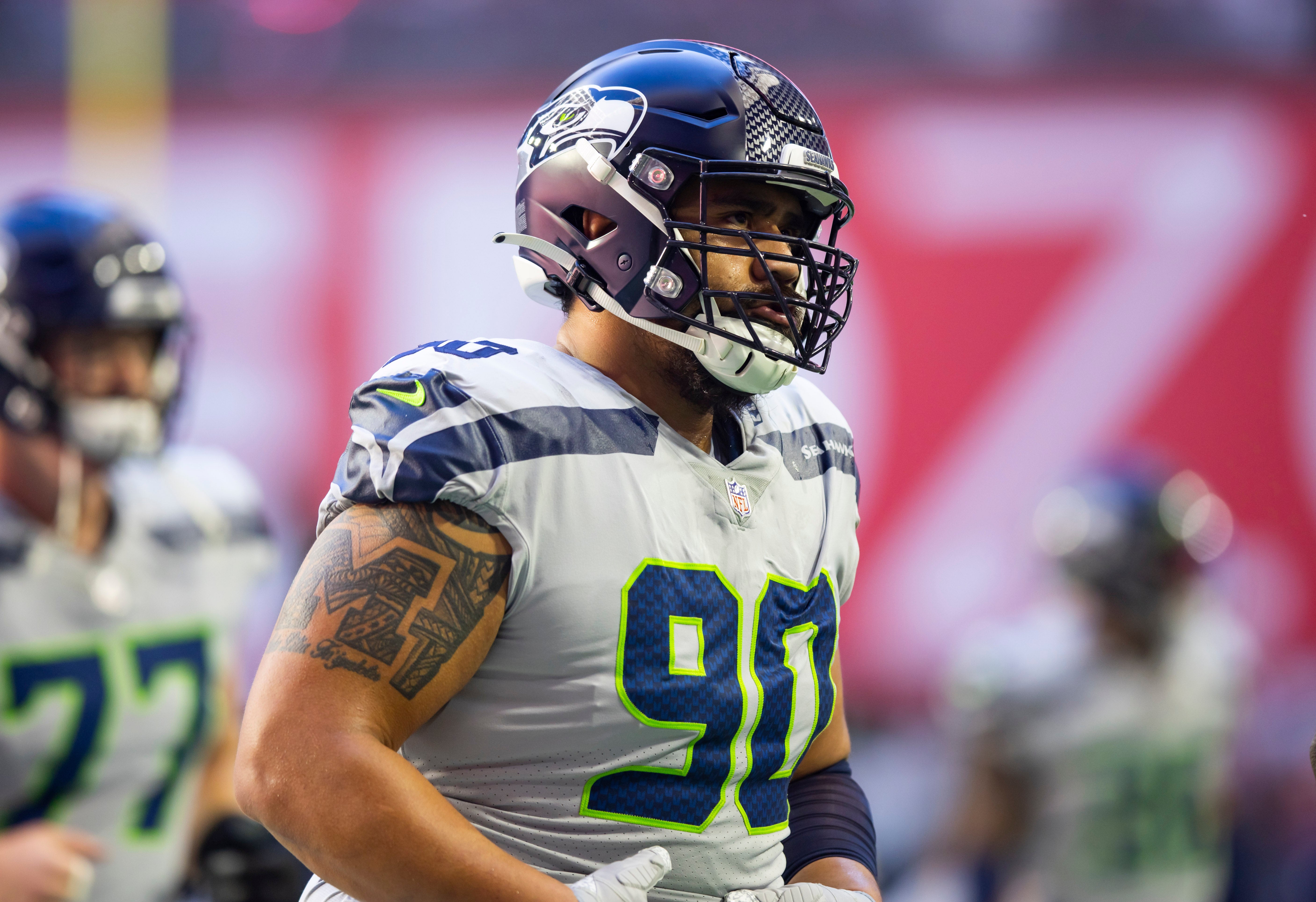 Jan 9, 2022; Glendale, Arizona, USA; Seattle Seahawks defensive tackle Bryan Mone (90) against the Arizona Cardinals at State Farm Stadium. Mandatory Credit: Mark J. Rebilas-USA TODAY Sports