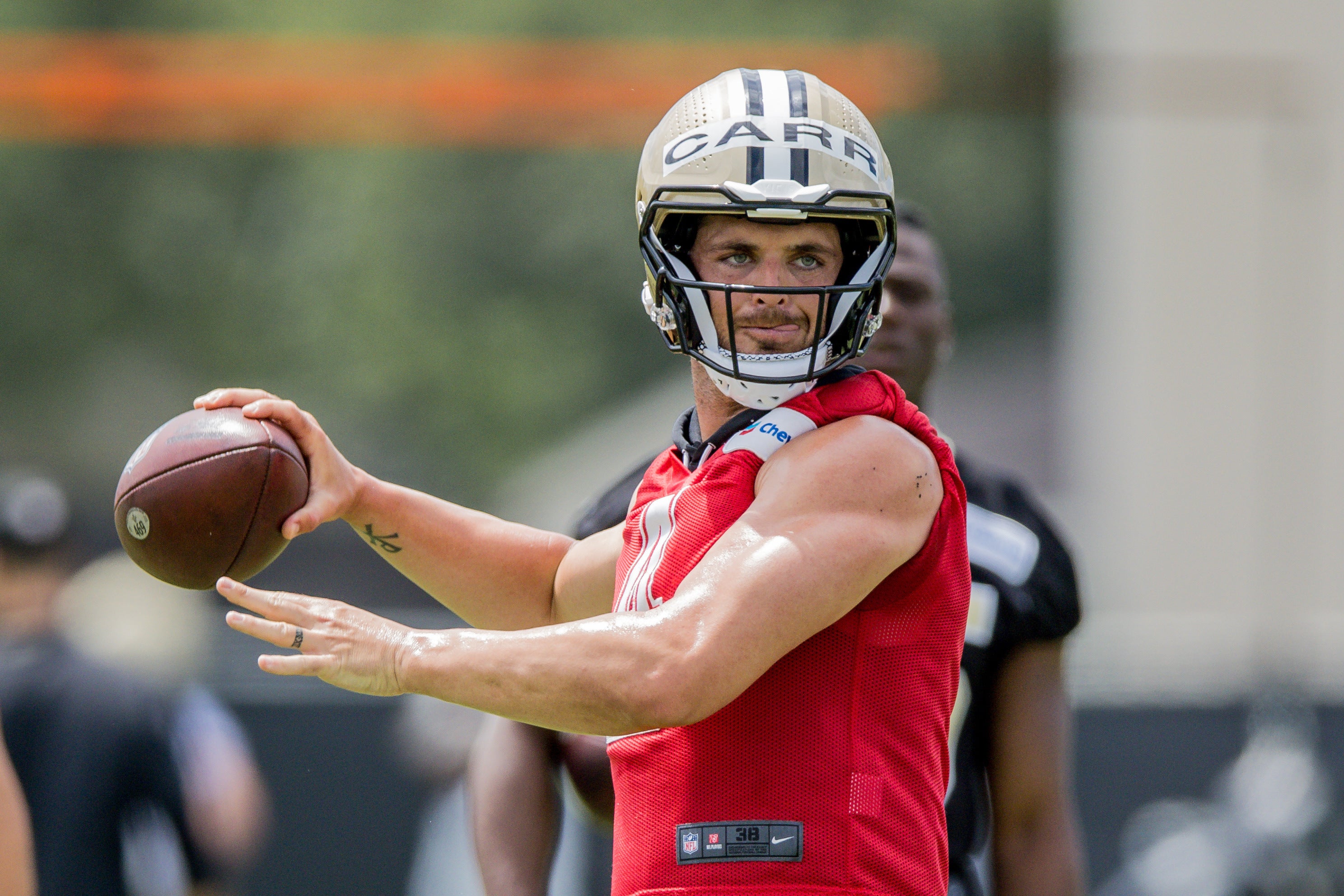 Jun 13, 2023; New Orleans, LA, USA; New Orleans Saints quarterback Derek Carr (4) passes during minicamp at the Ochsner Sports Performance Center.