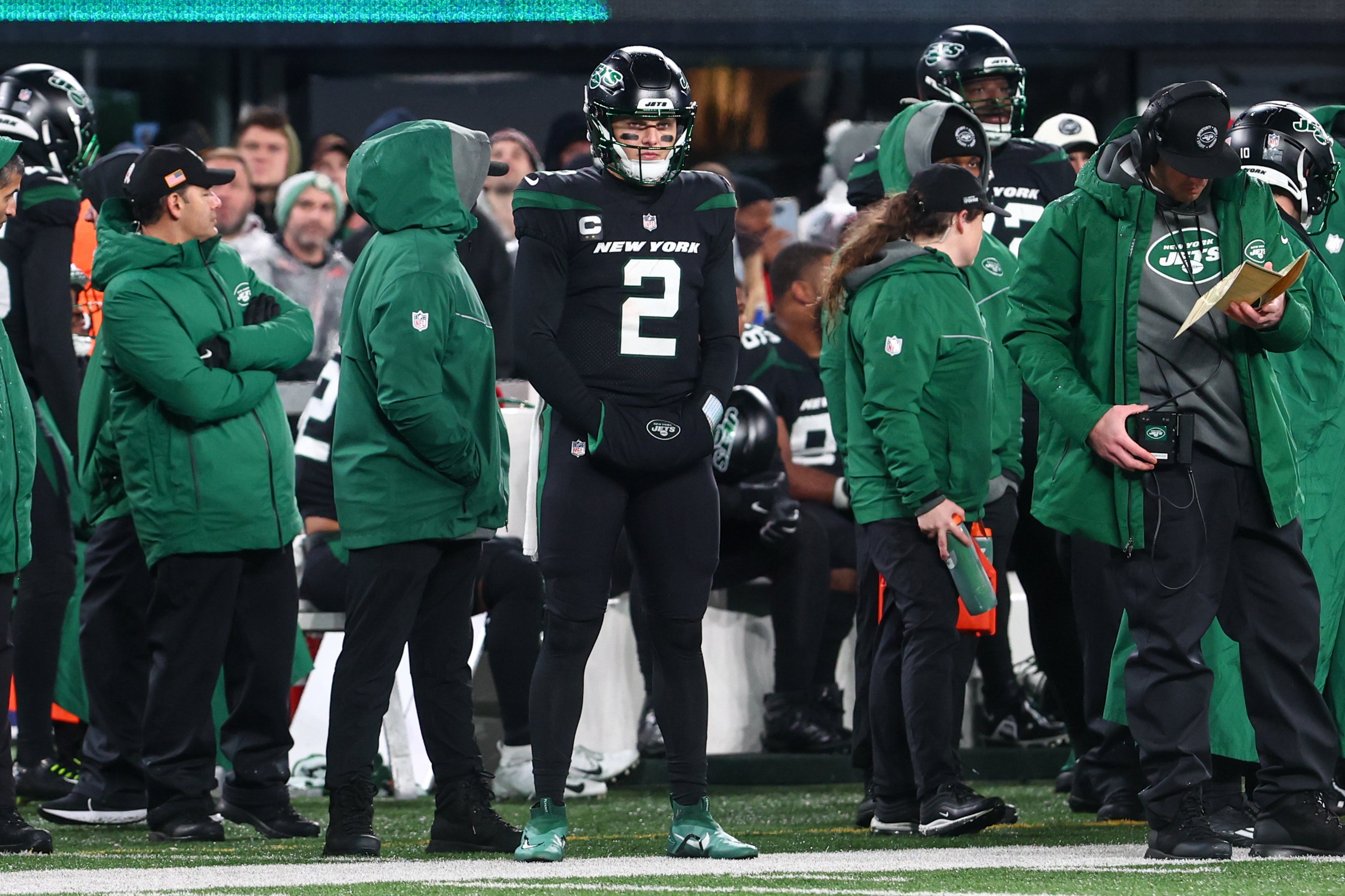 Dec 22, 2022; East Rutherford, New Jersey, USA; New York Jets quarterback Zach Wilson (2) watches from the sideline after being pulled from the game against the Jacksonville Jaguars during the second half at MetLife Stadium