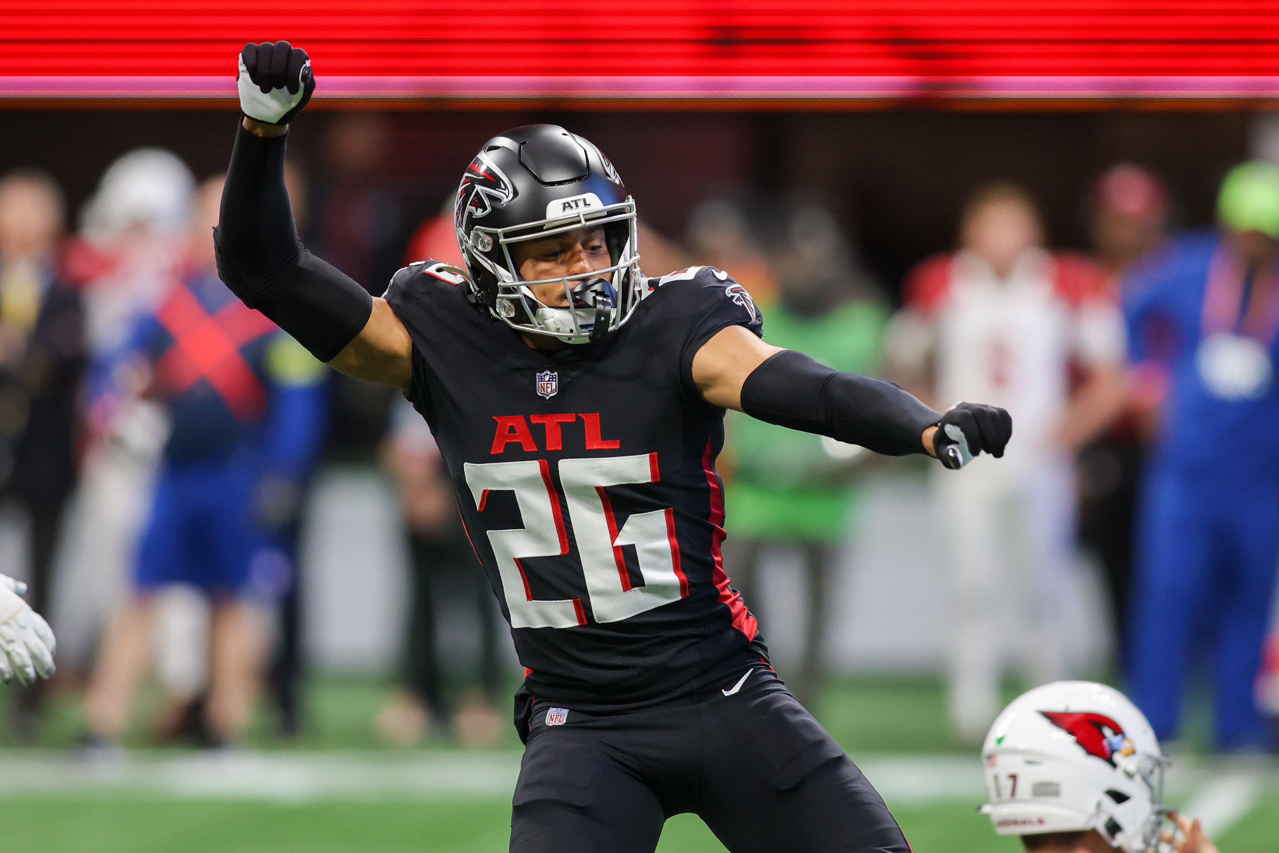 Jan 1, 2023; Atlanta, Georgia, USA; Atlanta Falcons cornerback Isaiah Oliver (26) celebrates after a sack against the Arizona Cardinals in the first half at Mercedes-Benz Stadium. Mandatory Credit: Brett Davis-USA TODAY Sports