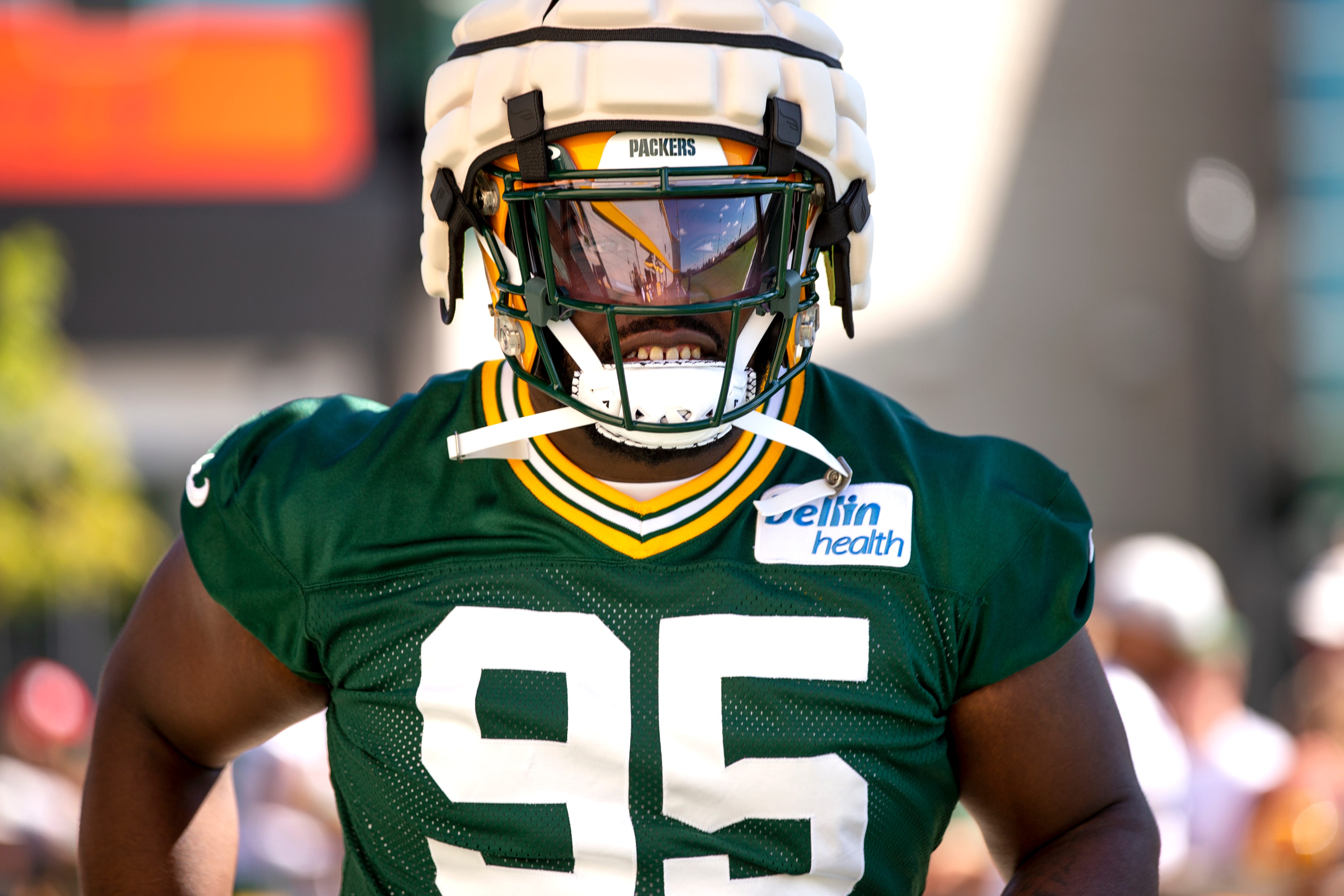 Green Bay Packers defensive lineman Devonte Wyatt (95) arrives to practice during Packers training camp on Thursday, July 28, 2022, at Ray Nitschke Field in Ashwaubenon, Wisconsin.