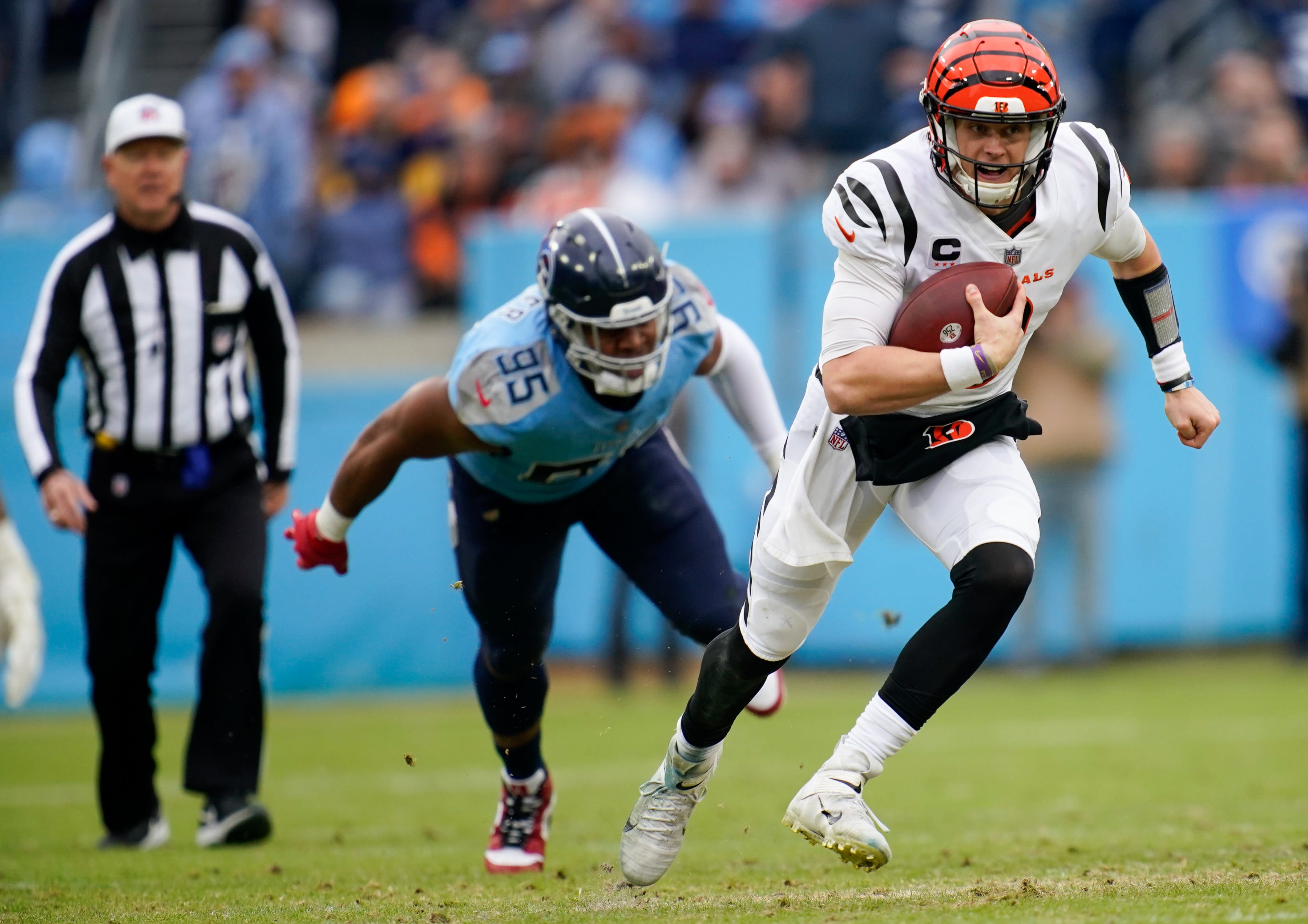 Cincinnati Bengals QB Joe Burrow getting away from Titans defense