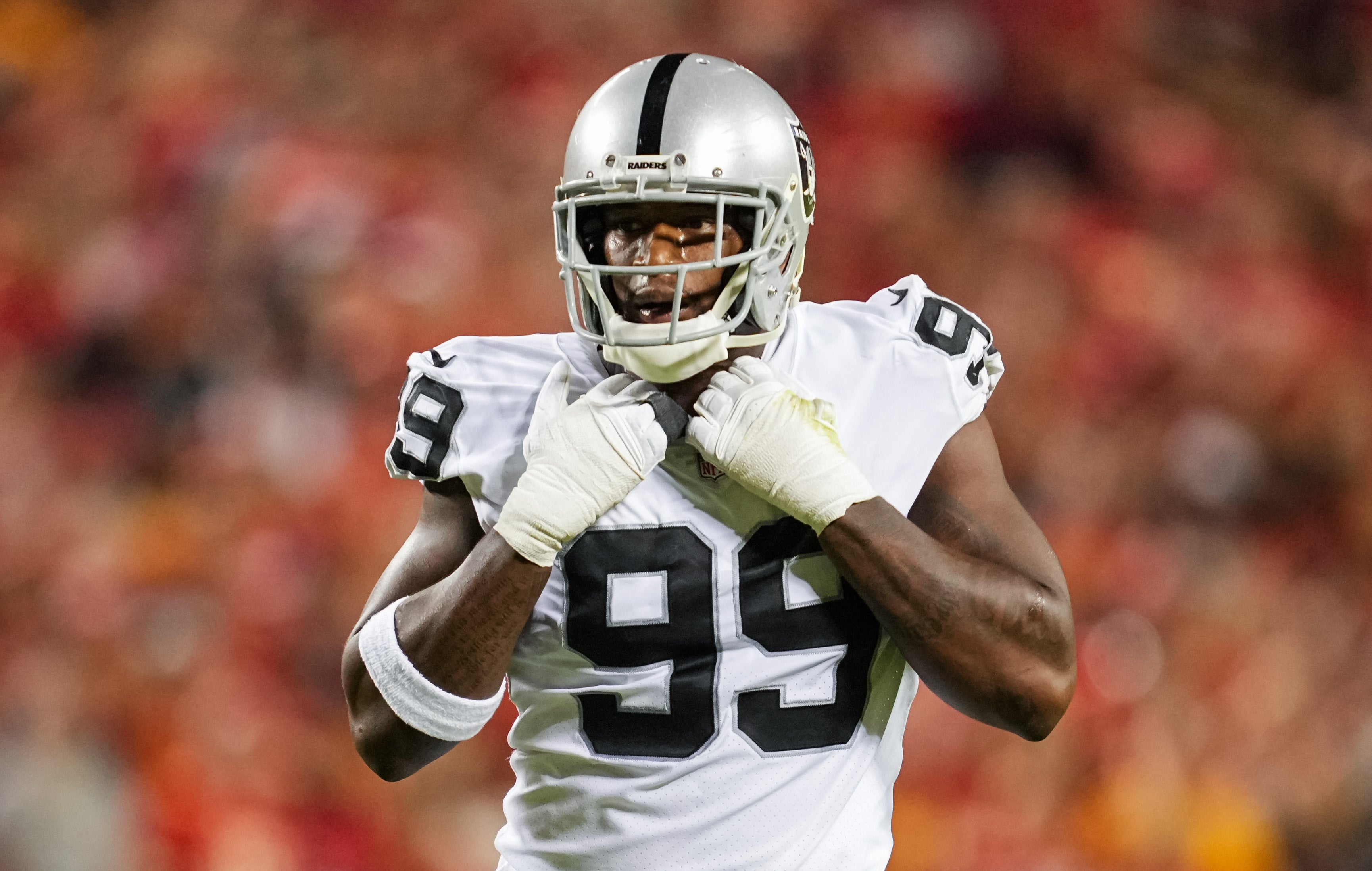 Oct 10, 2022; Kansas City, Missouri, USA; Las Vegas Raiders defensive end Clelin Ferrell (99) gets ready before the snap during the second half against the Kansas City Chiefs at GEHA Field at Arrowhead Stadium. Mandatory Credit: Jay Biggerstaff-USA TODAY Sports