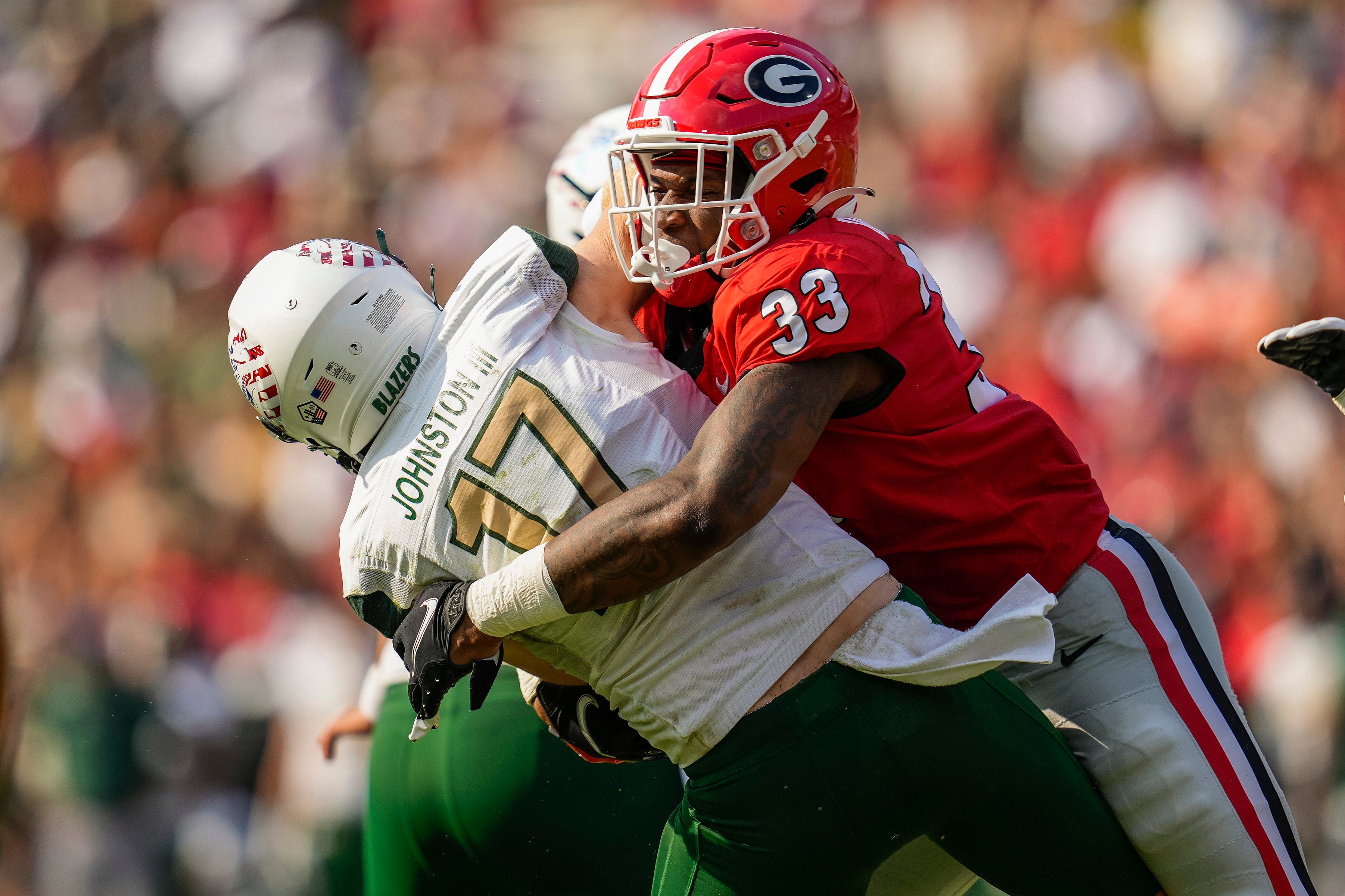 Sep 11, 2021; Athens, Georgia, USA; Georgia Bulldogs linebacker Robert Beal Jr. (33) hits UAB Blazers quarterback Tyler Johnston III (17) as he throws during the first half at Sanford Stadium. Mandatory Credit: Dale Zanine-USA TODAY Sports