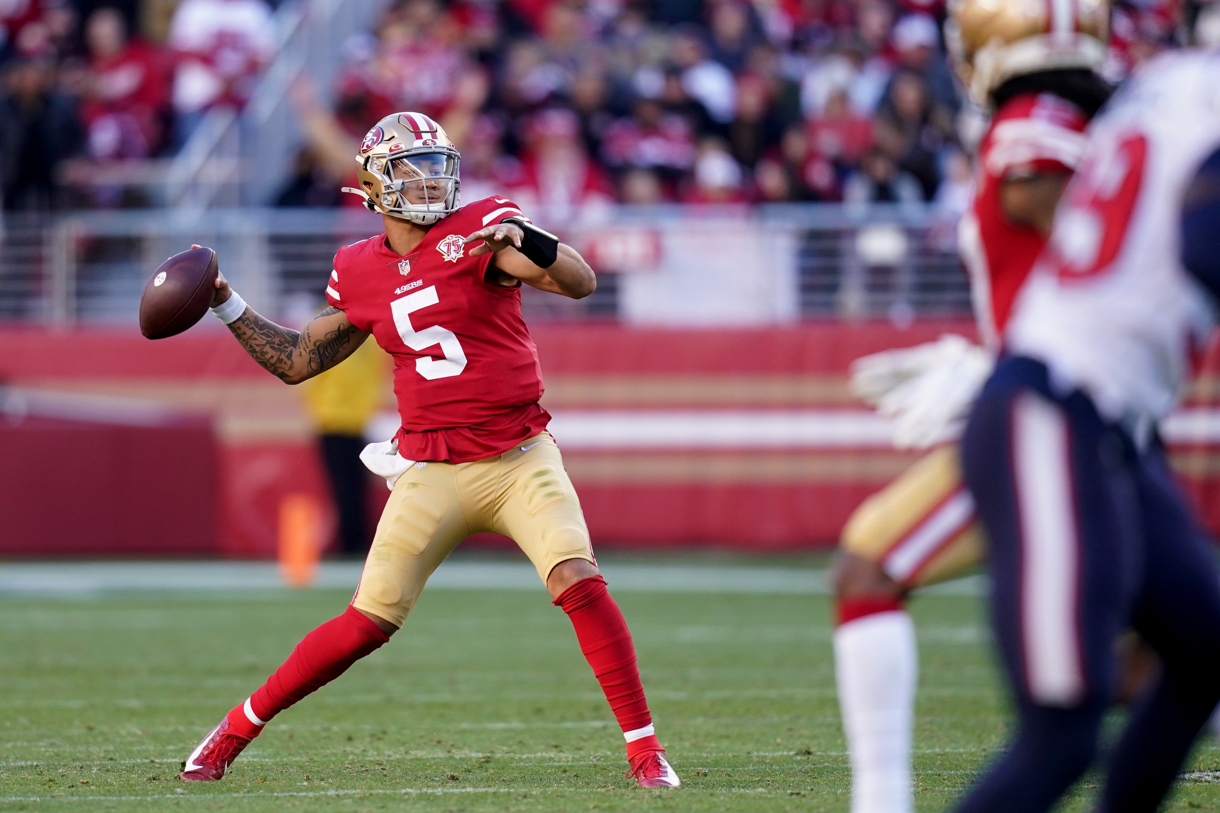Jan 2, 2022; Santa Clara, California, USA; San Francisco 49ers quarterback Trey Lance (5) throws a pass for a touchdown against the Houston Texans in the fourth quarter at Levi's Stadium. Mandatory Credit: Cary Edmondson-USA TODAY Sports