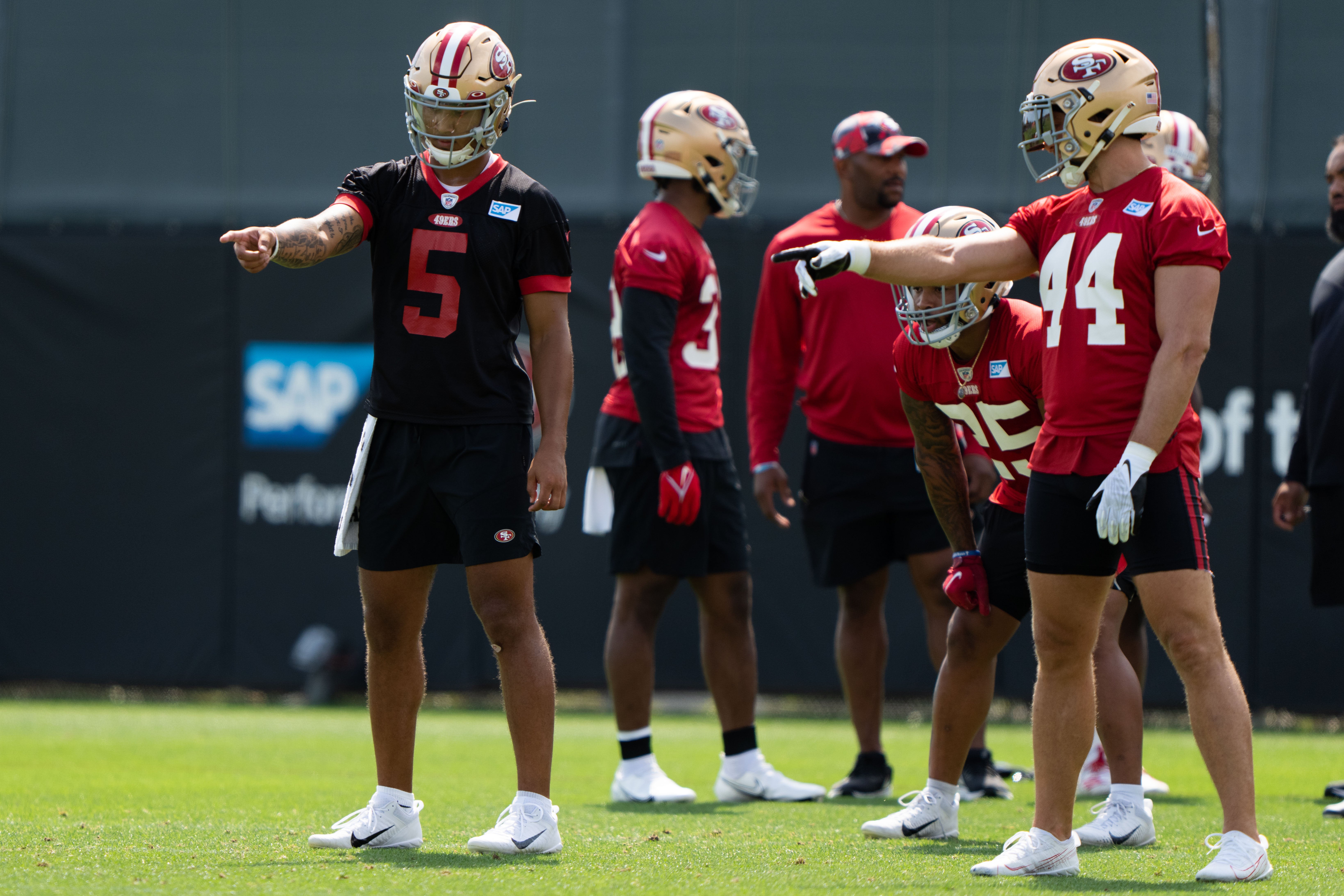 Jul 29, 2022; Santa Clara, CA, USA; San Francisco 49ers quarterback Trey Lance (5) and fullback Kyle Juszczyk (44) point during training camp at the SAP Performance Facility near Levi's Stadium. Mandatory Credit: Stan Szeto-USA TODAY Sports
