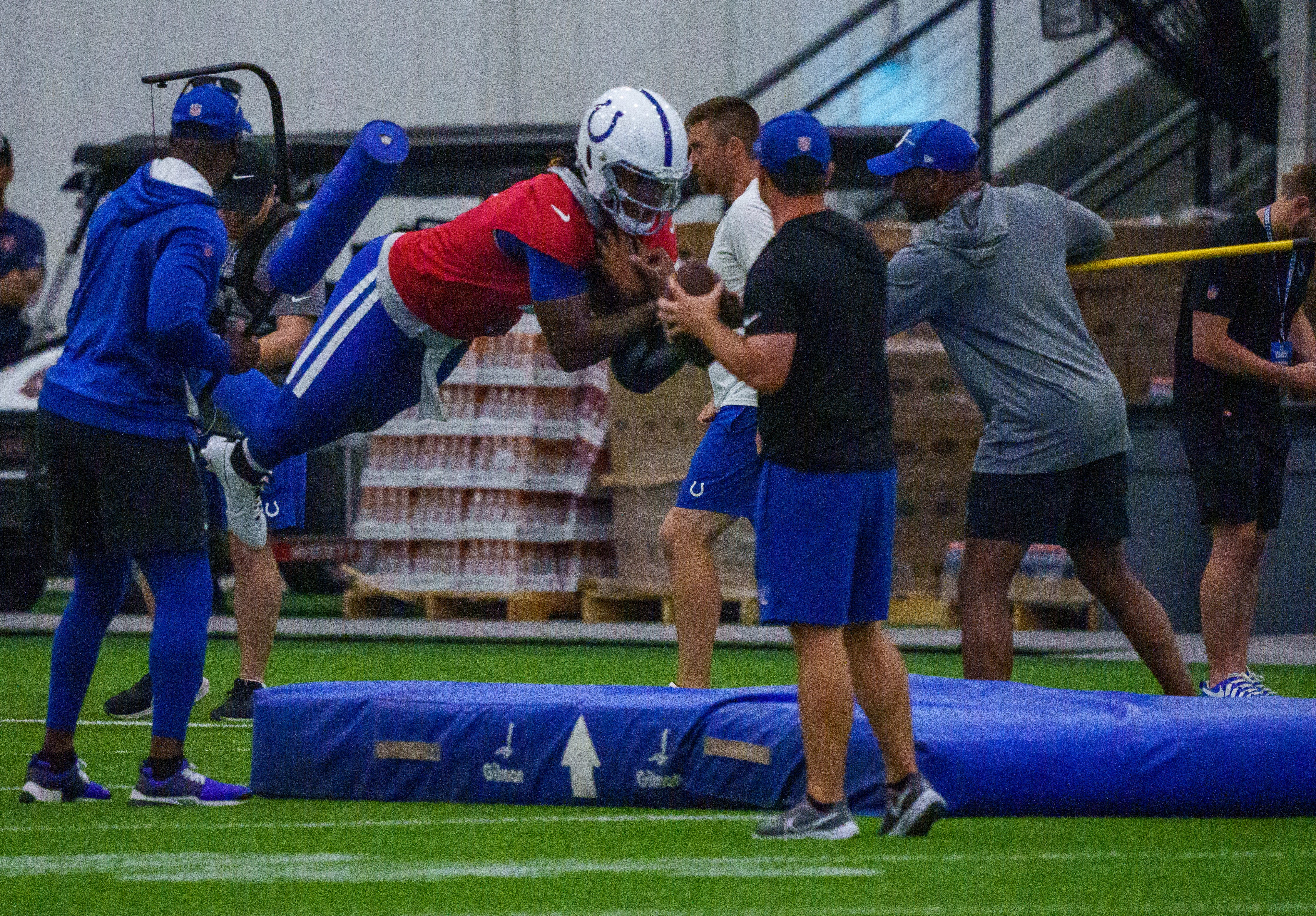 Indianapolis Colts quarterback Anthony Richardson (5) takes a leap Friday, July 28, 2023, during an indoor practice at Grand Park Sports Campus in Westfield, Indiana.