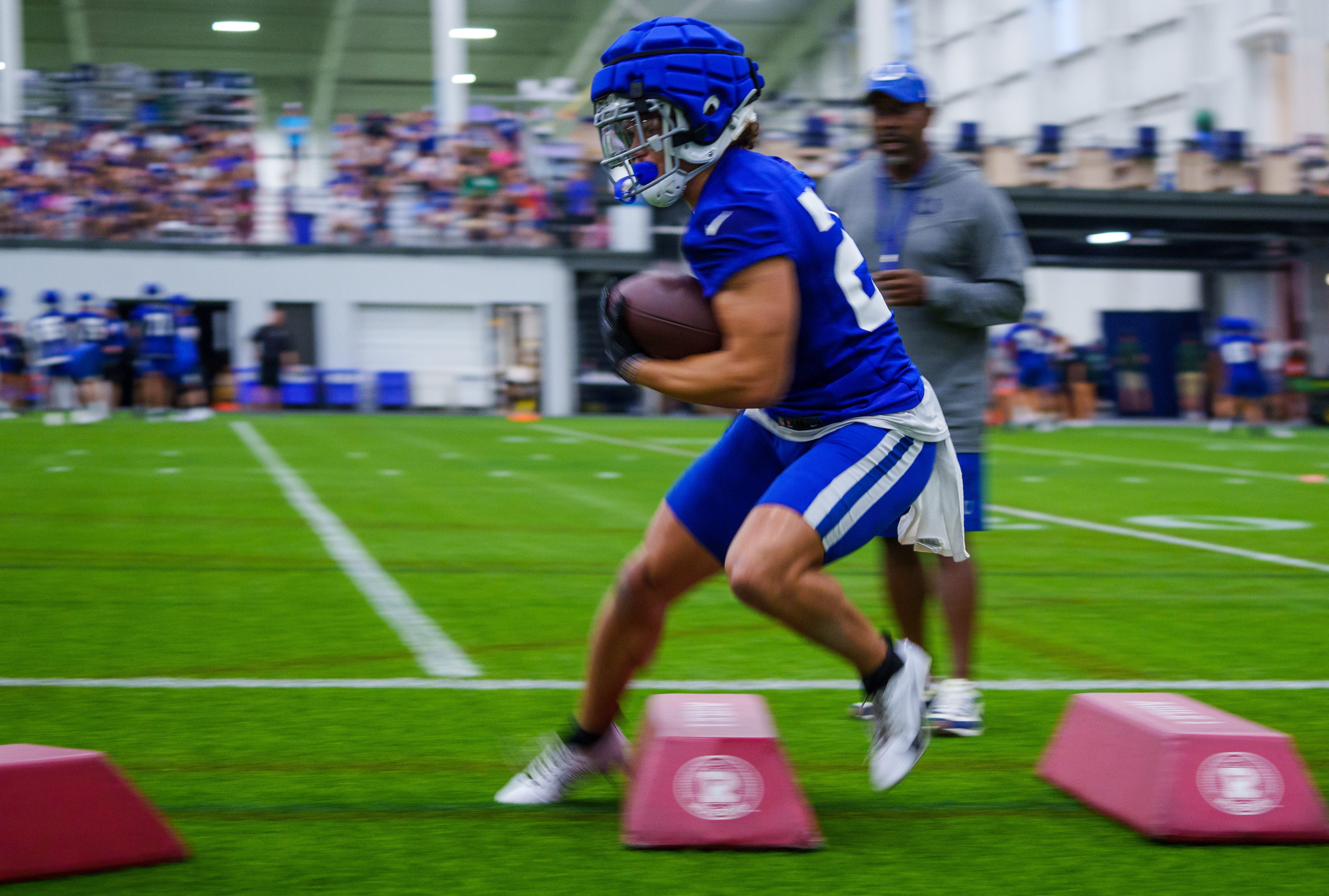 Indianapolis Colts running back Evan Hull (26) runs over obstacles Friday, July 28, 2023, during an indoor practice at Grand Park Sports Campus in Westfield, Indiana.