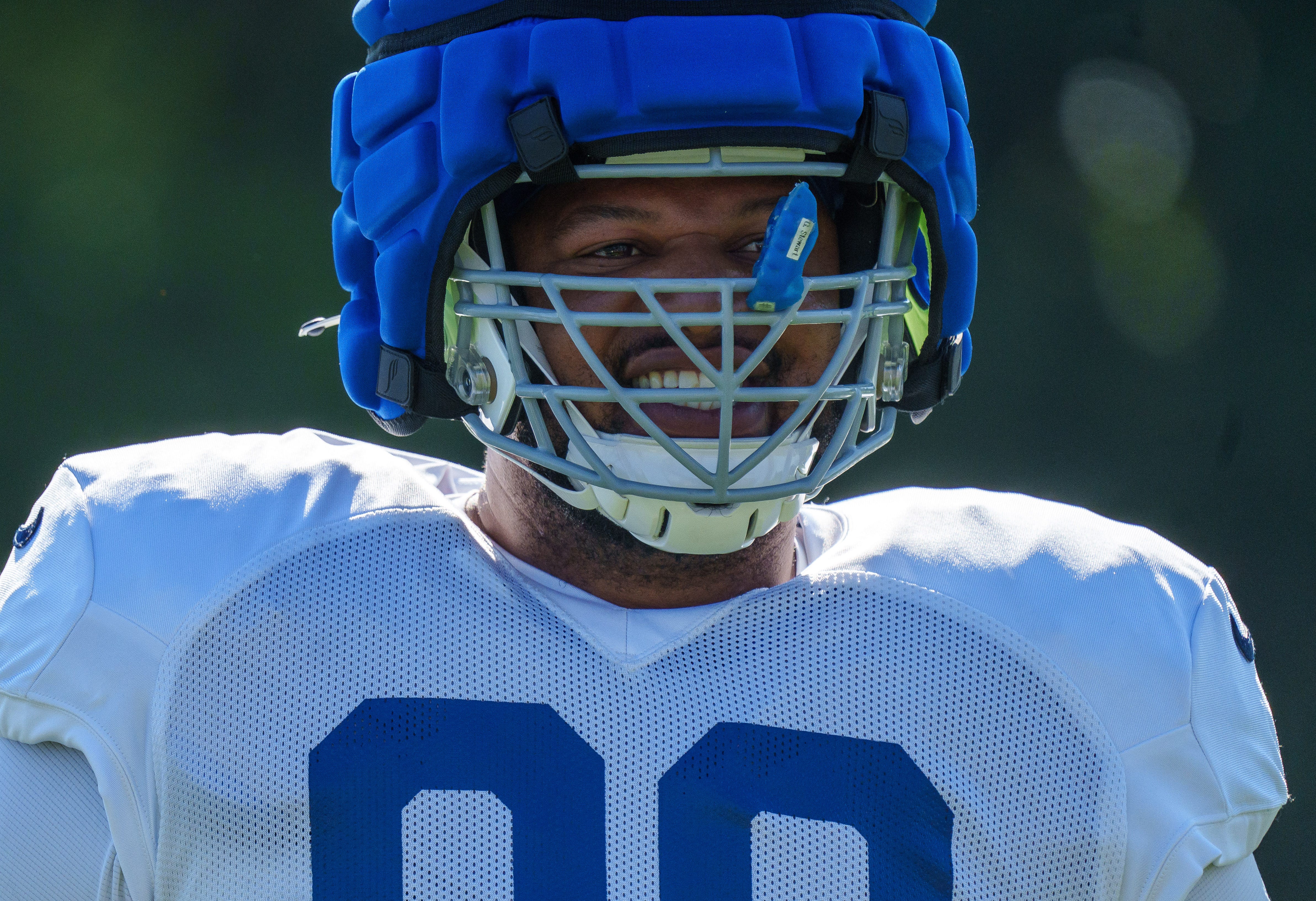Indianapolis Colts defensive tackle Grover Stewart (90) smiles with teammates Monday, July 31, 2023, during training camp at the Grand Park Sports Campus in Westfield, Indiana.