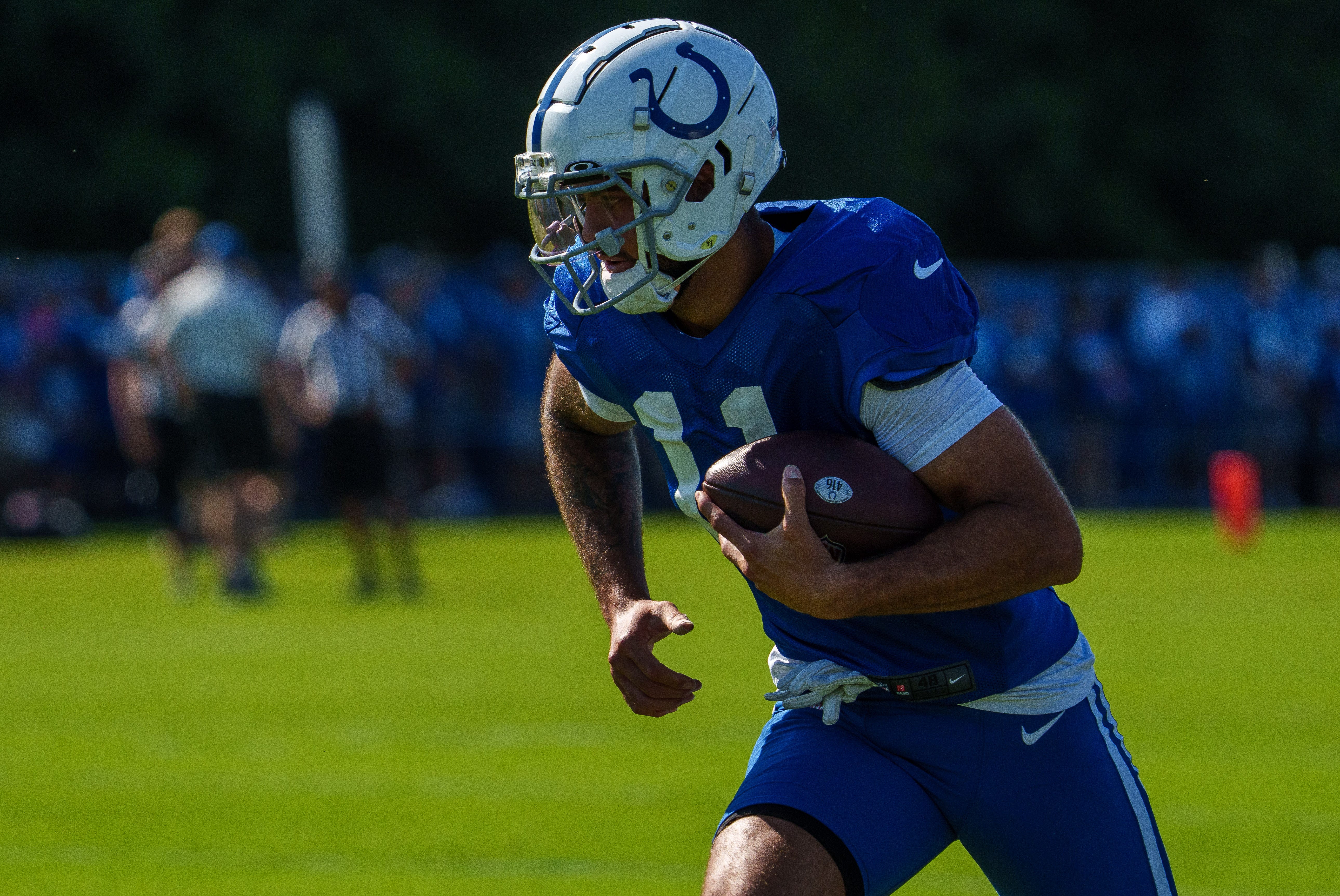 Indianapolis Colts wide receiver Michael Pittman Jr. (11) runs after catching a pass Monday, July 31, 2023, during training camp at the Grand Park Sports Campus in Westfield, Indiana.