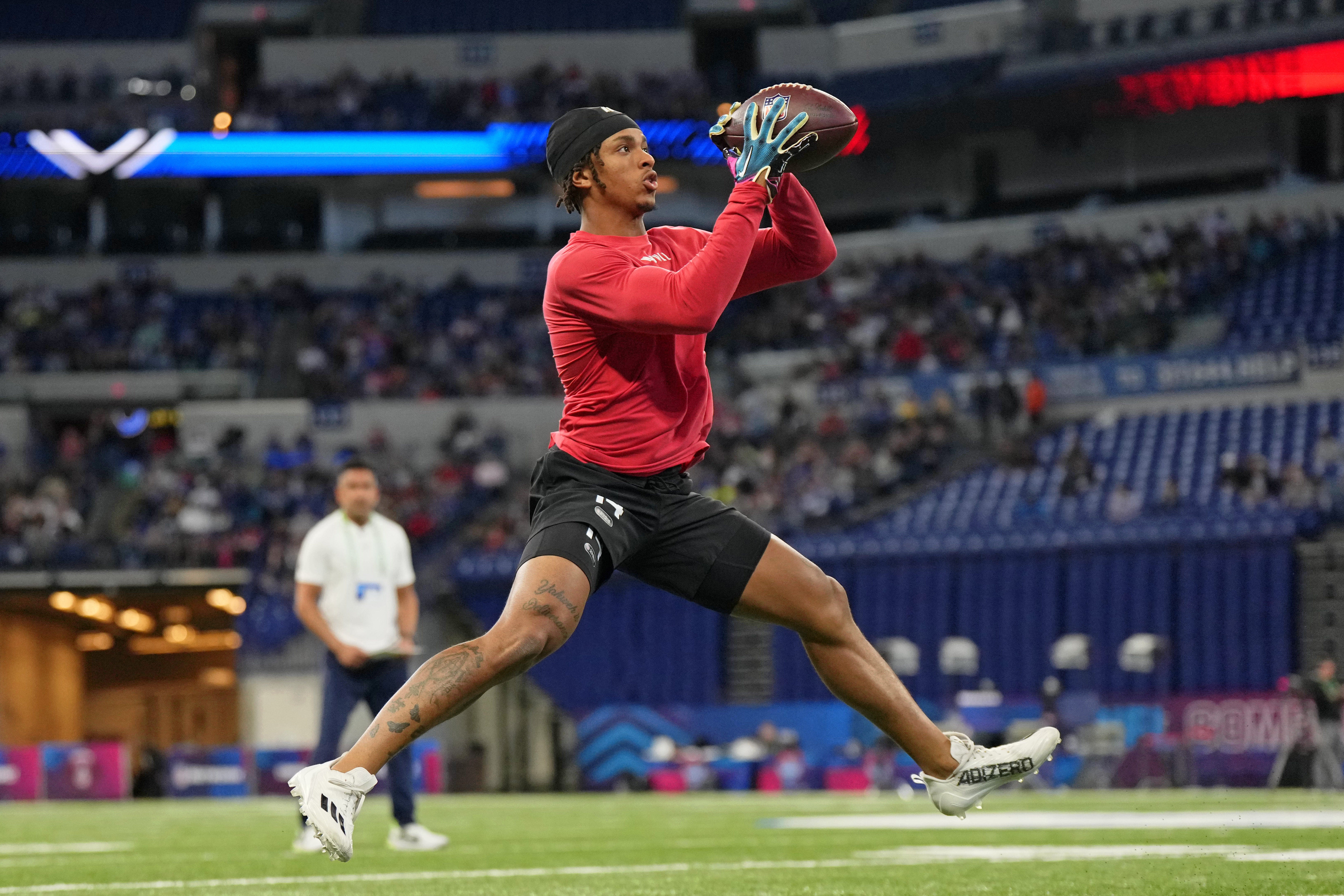 Mar 4, 2023; Indianapolis, IN, USA; North Carolina wide receiver Josh Downs (WO14) participates in drills at Lucas Oil Stadium.