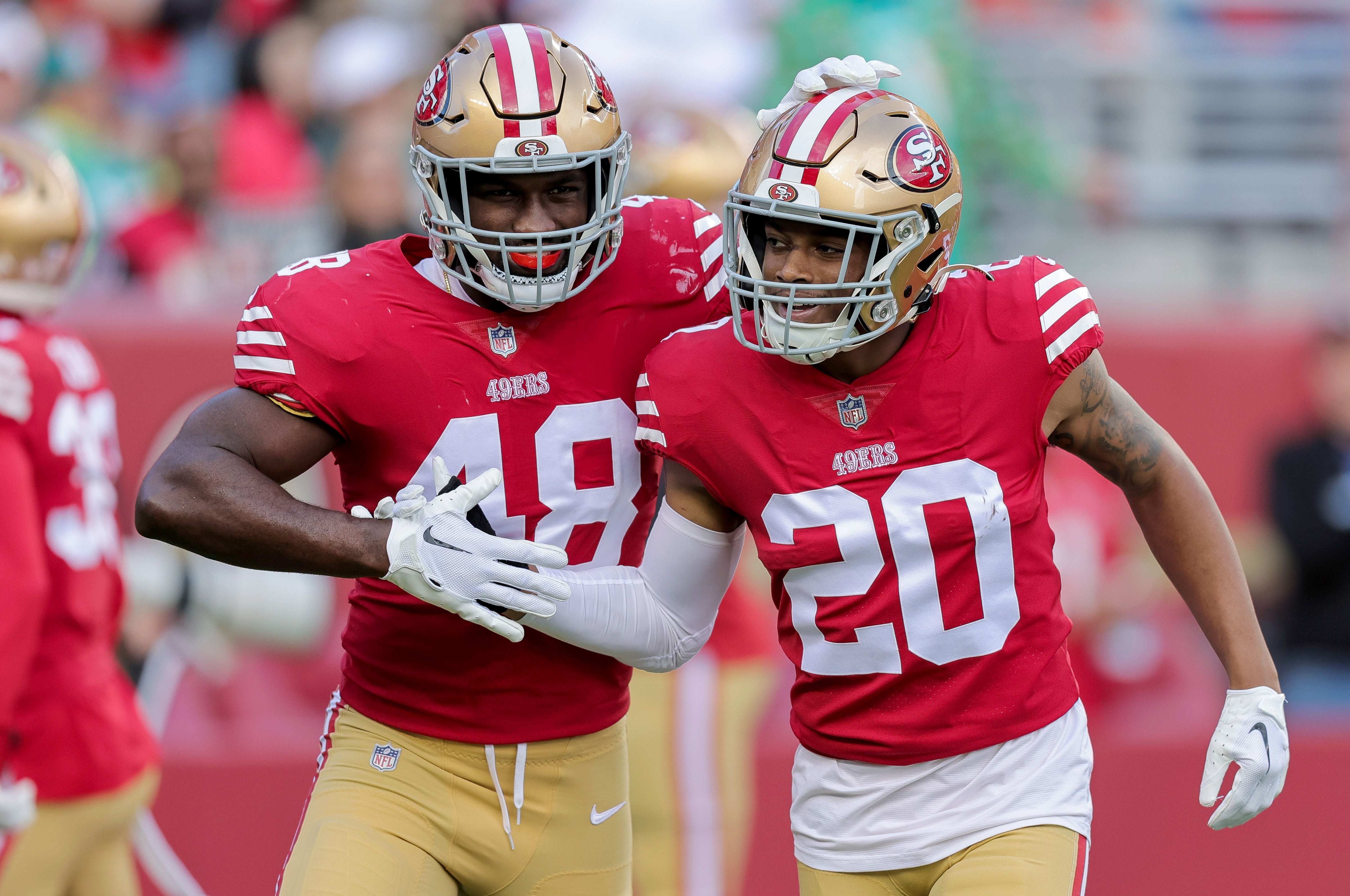 Dec 4, 2022; Santa Clara, California, USA; San Francisco 49ers linebacker Oren Burks (48) celebrates with cornerback Ambry Thomas (20) after a play during the first quarter against the Miami Dolphins at Levi's Stadium. Mandatory Credit: Sergio Estrada-USA TODAY Sports