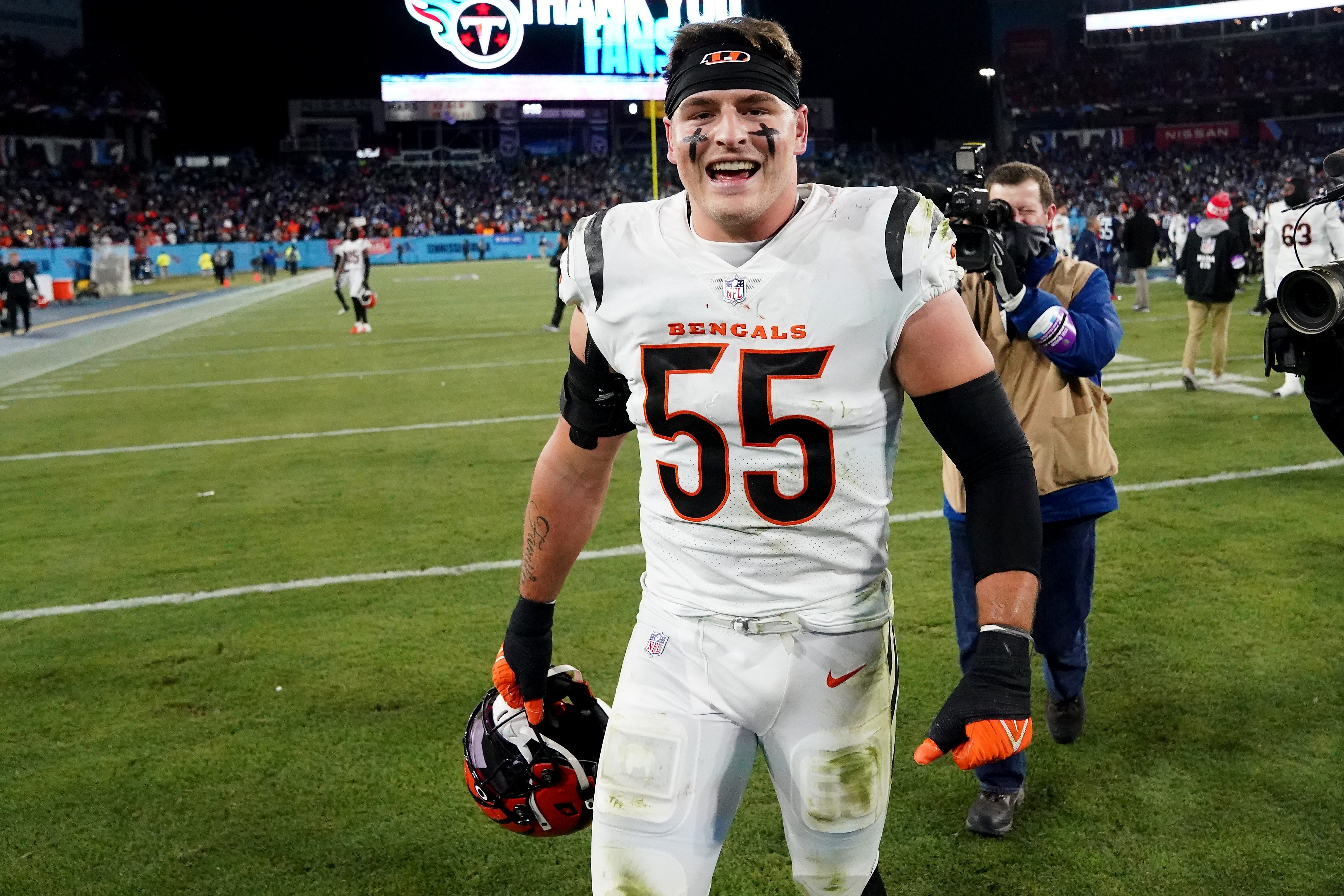 Cincinnati Bengals linebacker Logan Wilson (55) celebrates the win at the conclusion of an NFL divisional playoff football game, Saturday, Jan. 22, 2022, at Nissan Stadium in Nashville. The Cincinnati Bengals defeated the Tennessee Titans, 19-16, to advance to the AFC Championship game. Cincinnati Bengals At Tennessee Titans Jan 22 Afc Divisional Playoffs