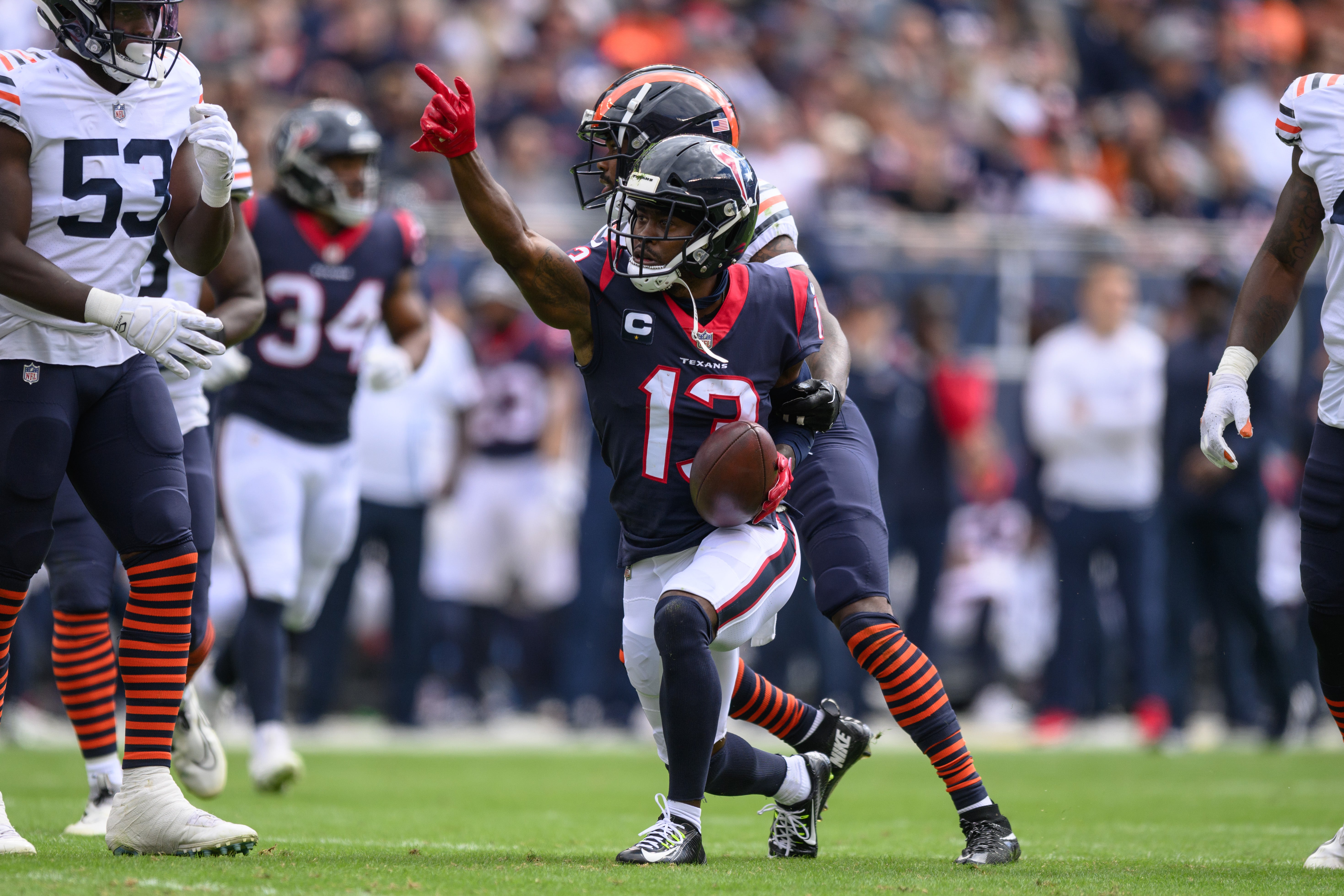 Sep 25, 2022; Chicago, Illinois, USA; Houston Texans wide receiver Brandin Cooks (13) signals first down after a catch in the first quarter against the Chicago Bears at Soldier Field.