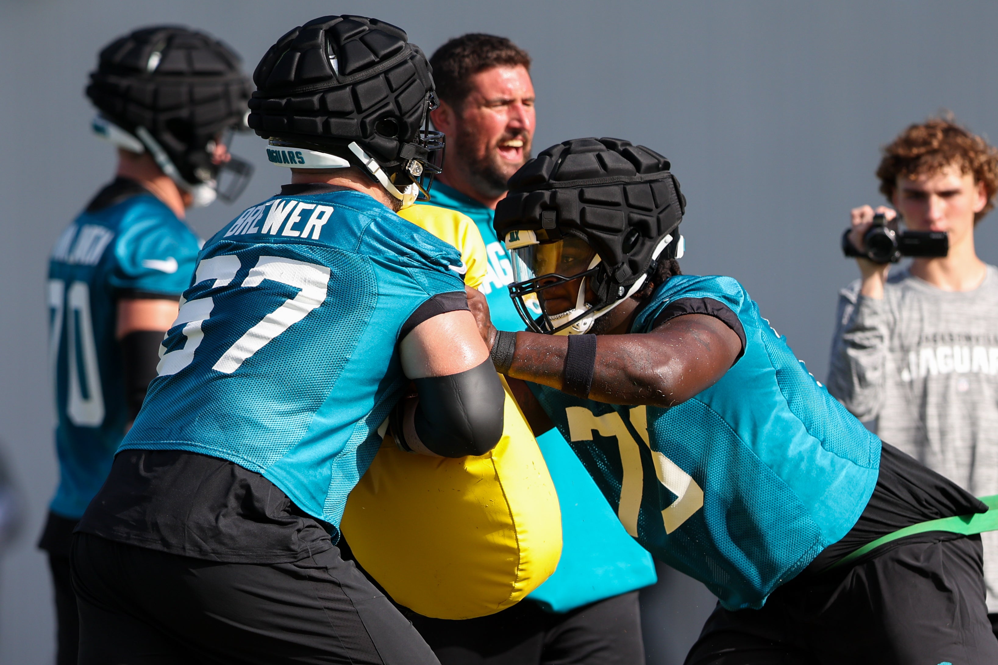 Jacksonville Jaguars offensive tackle Chandler Brewer (67) and Jacksonville Jaguars offensive tackle Anton Harrison (76) participate in training camp at Miller Electric Performance Center. Nathan Ray Seebeck-USA TODAY Sports