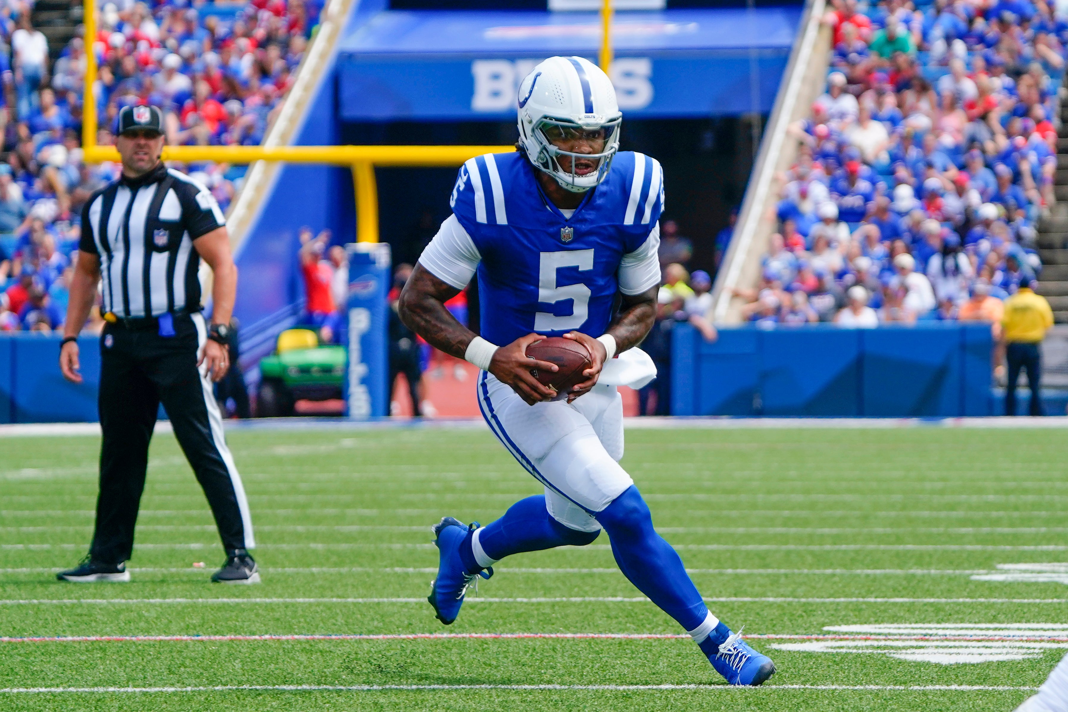 Aug 12, 2023; Orchard Park, New York, USA; Indianapolis Colts quarterback Anthony Richardson (5) runs with the ball against the Buffalo Bills during the first half at Highmark Stadium.