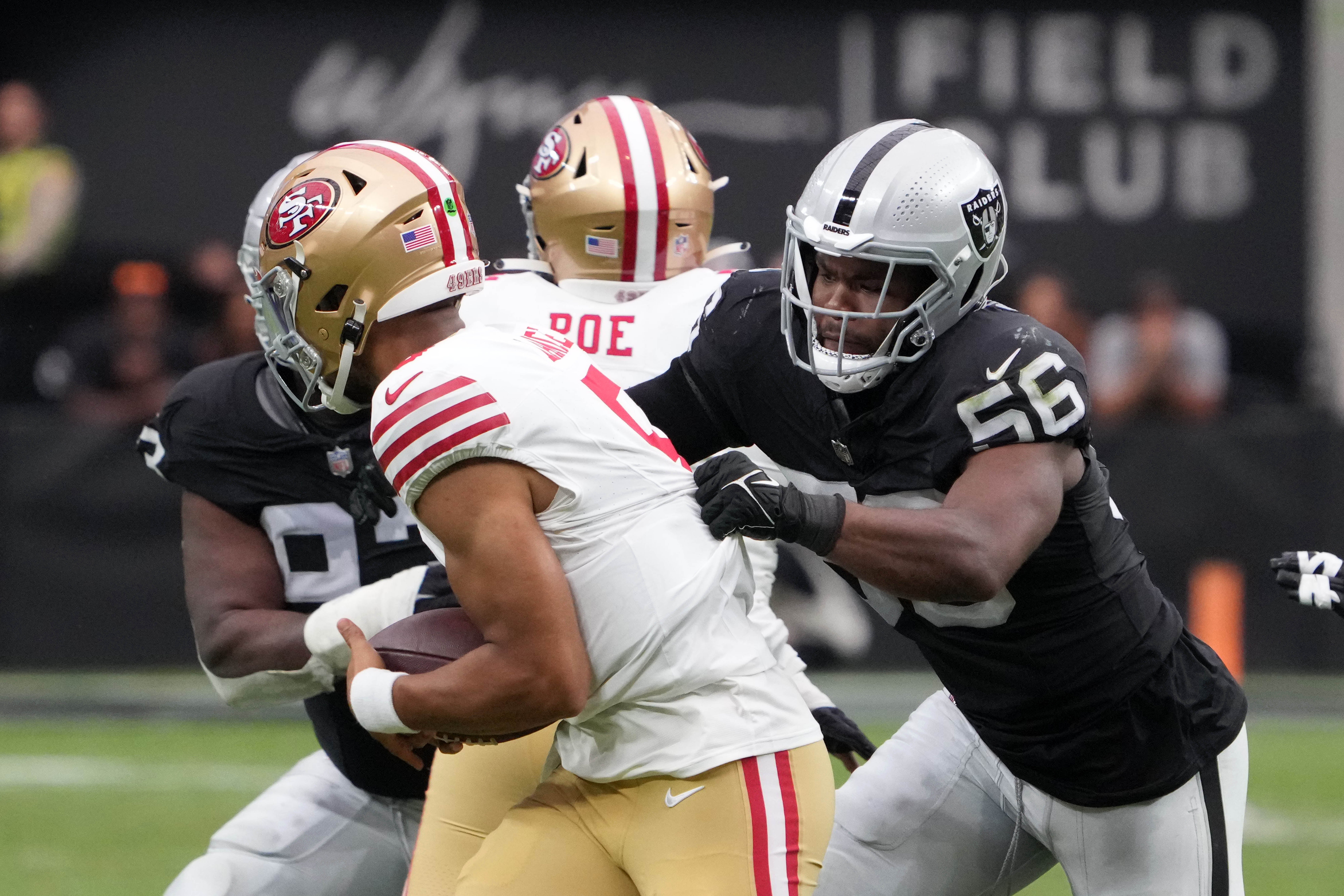 Aug 13, 2023; Paradise, Nevada, USA; Las Vegas Raiders linebacker Amari Burney (56) sacks San Francisco 49ers quarterback Trey Lance (5) in the first half at Allegiant Stadium. Mandatory Credit: Kirby Lee-USA TODAY Sports