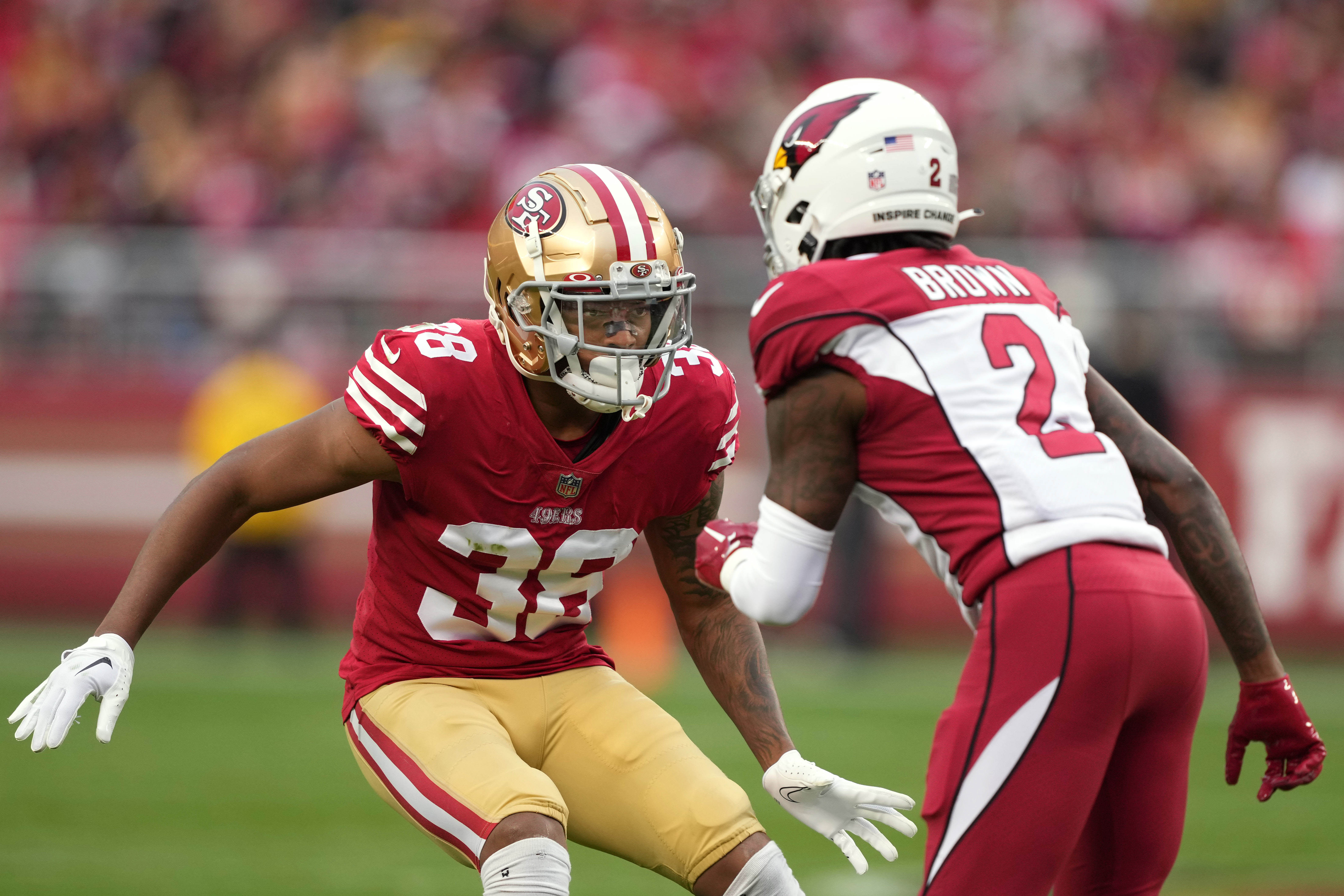 Jan 8, 2023; Santa Clara, California, USA; San Francisco 49ers cornerback Deommodore Lenoir (38) defends against Arizona Cardinals wide receiver Marquise Brown (2) during the third quarter at Levi's Stadium. Mandatory Credit: Darren Yamashita-USA TODAY Sports