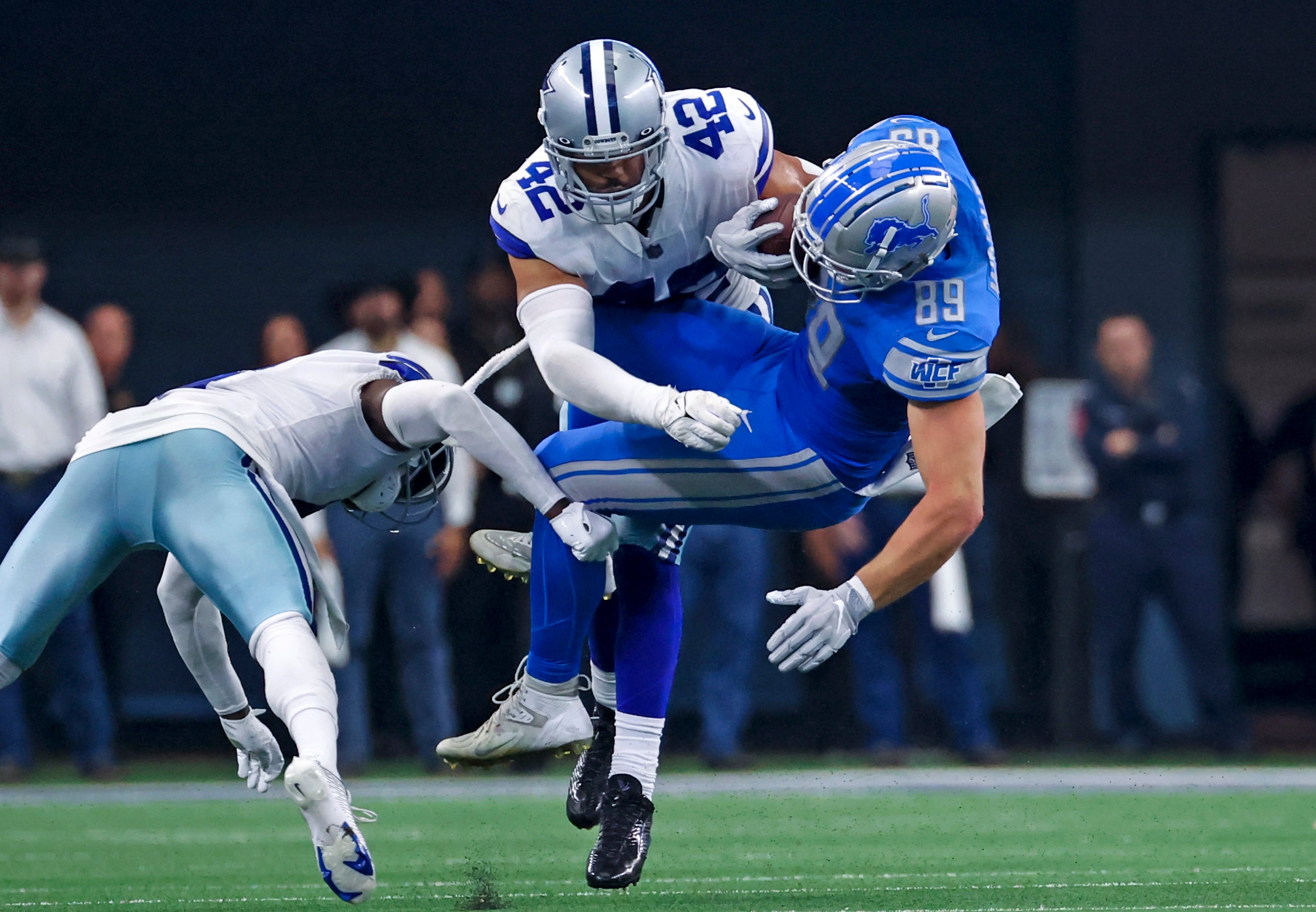 Dallas Cowboys linebacker Anthony Barr (42) tackles Detroit Lions tight end Brock Wright (89) during the second half at AT&T Stadium. Mandatory Credit: Kevin Jairaj-USA TODAY Sports