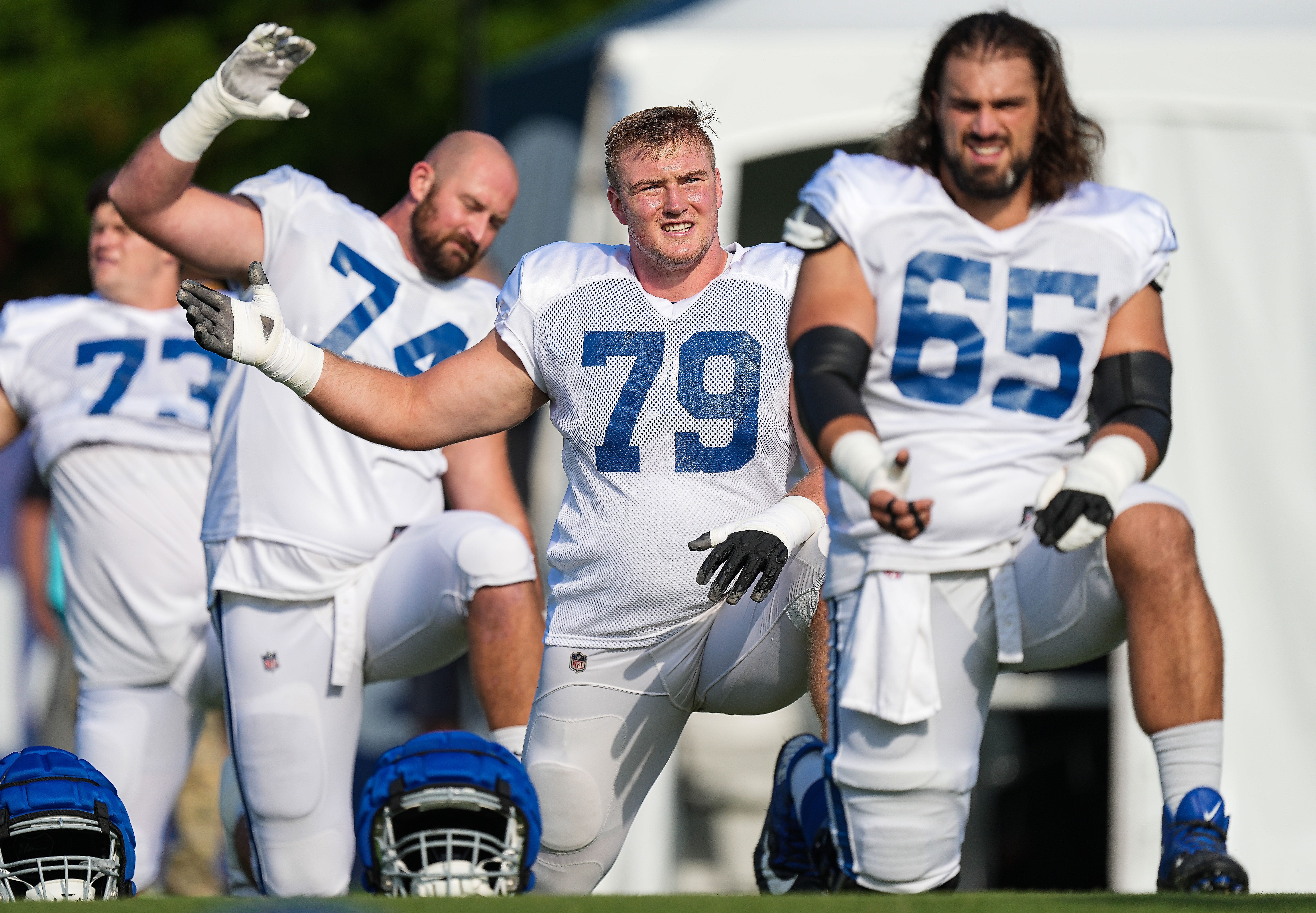 Indianapolis Colts offensive tackle Bernhard Raimann (79)stretches before the start of practice Thursday, Aug. 17, 2023, during training camp at Grand Park Sports Campus in Westfield.
