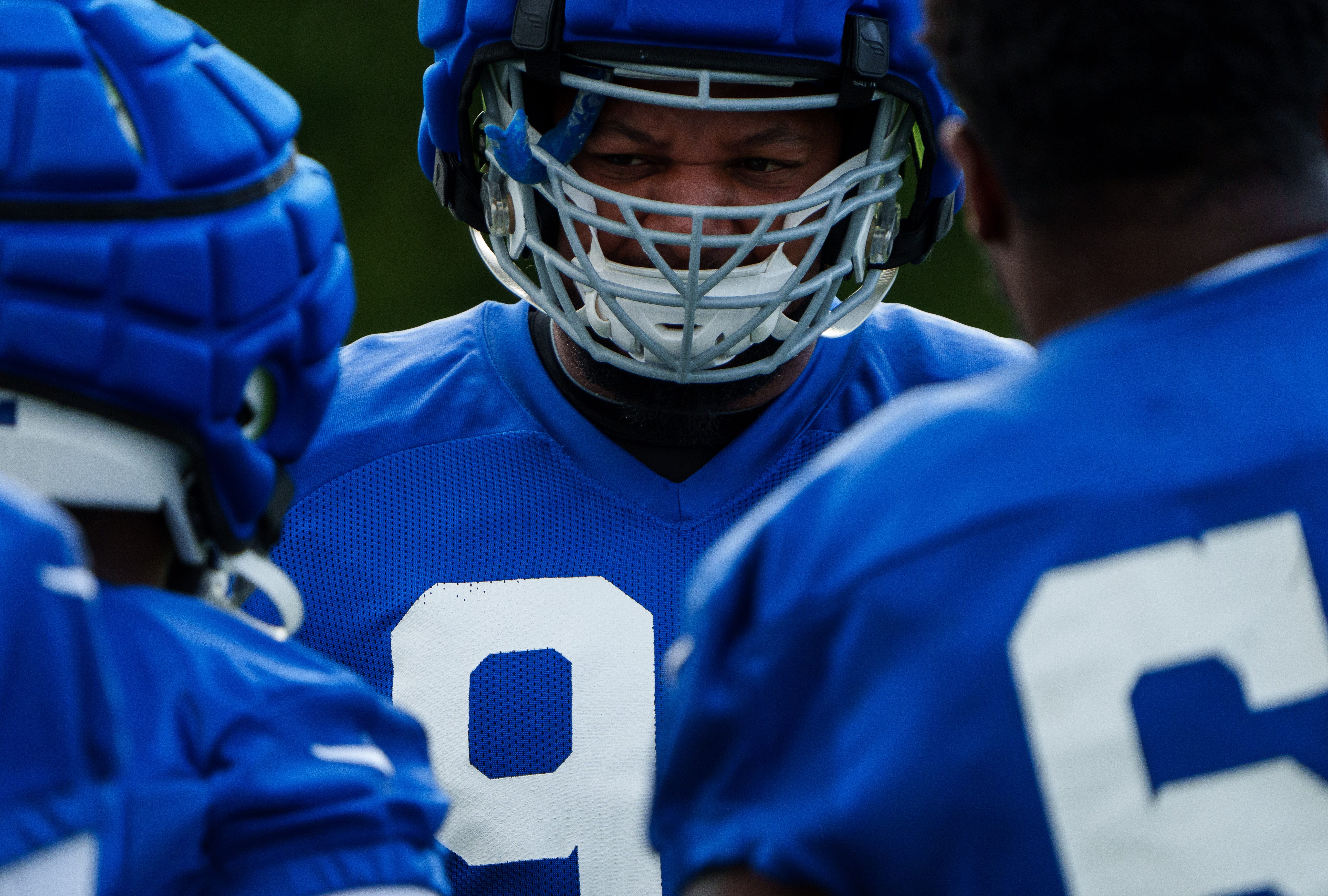 Indianapolis Colts defensive tackle Grover Stewart (90) lines up for stretching Tuesday, Aug. 15, 2023, during training camp at Grand Park Sports Campus in Westfield, Indiana.