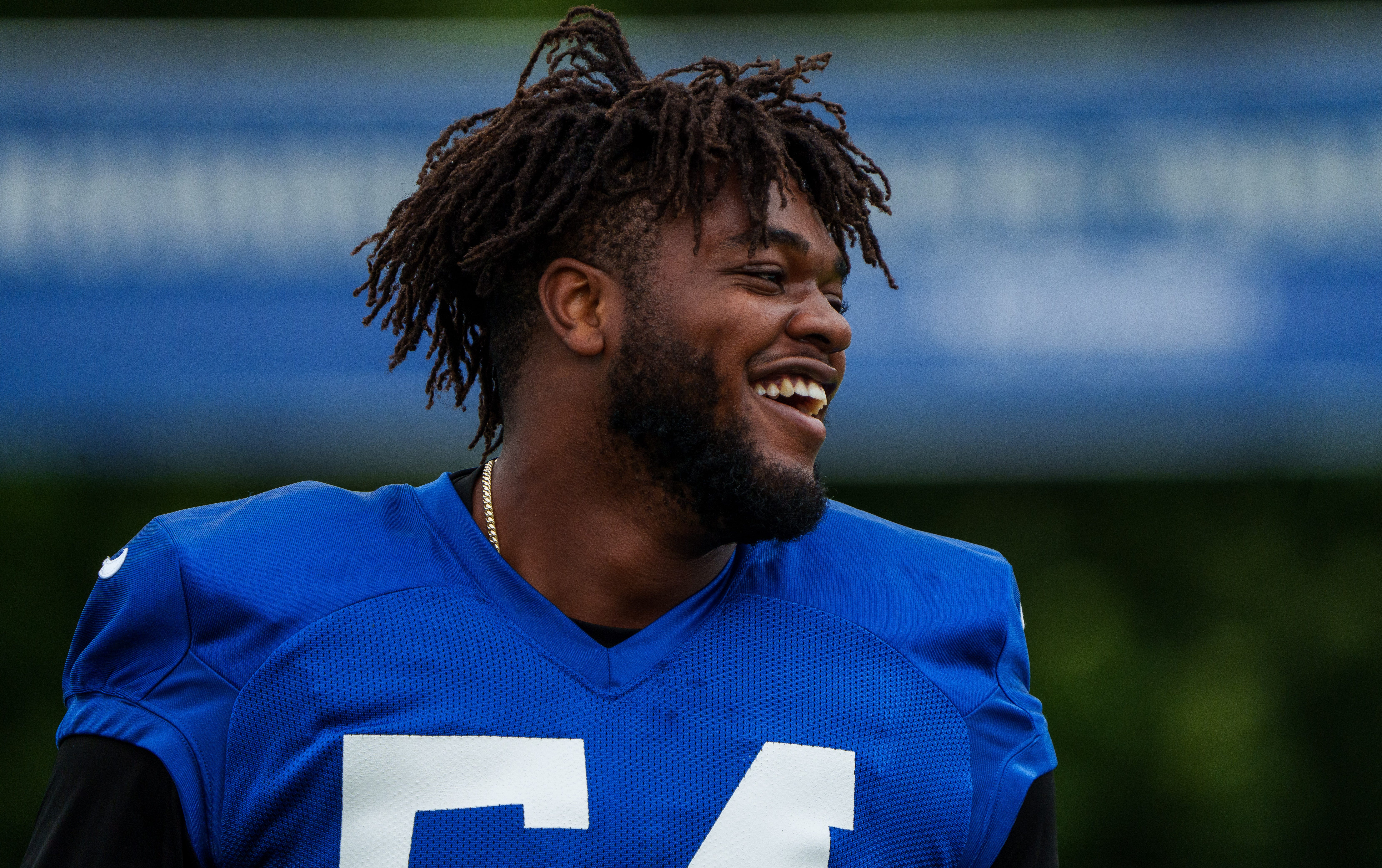 Indianapolis Colts defensive end Dayo Odeyingbo (54) laughs with teammates Tuesday, Aug. 15, 2023, during training camp at Grand Park Sports Campus in Westfield, Indiana.