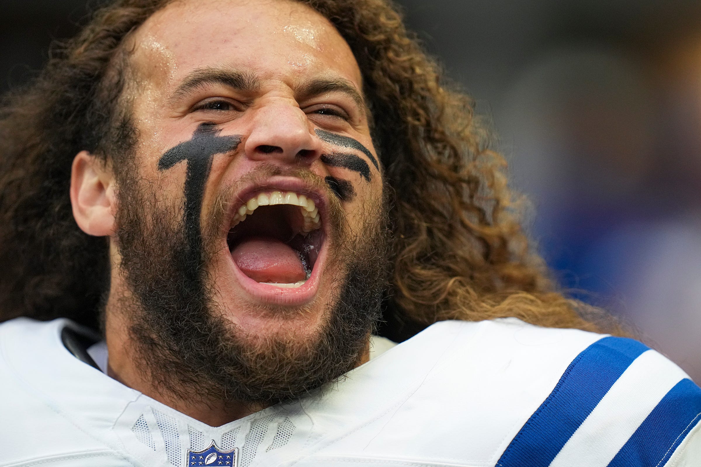 Indianapolis Colts linebacker Grant Stuard (41) stretches his jaw out as he takes the field for an NFL preseason game against the Chicago Bears on Saturday, Aug. 19, 2023, at Lucas Oil Stadium in Indianapolis.