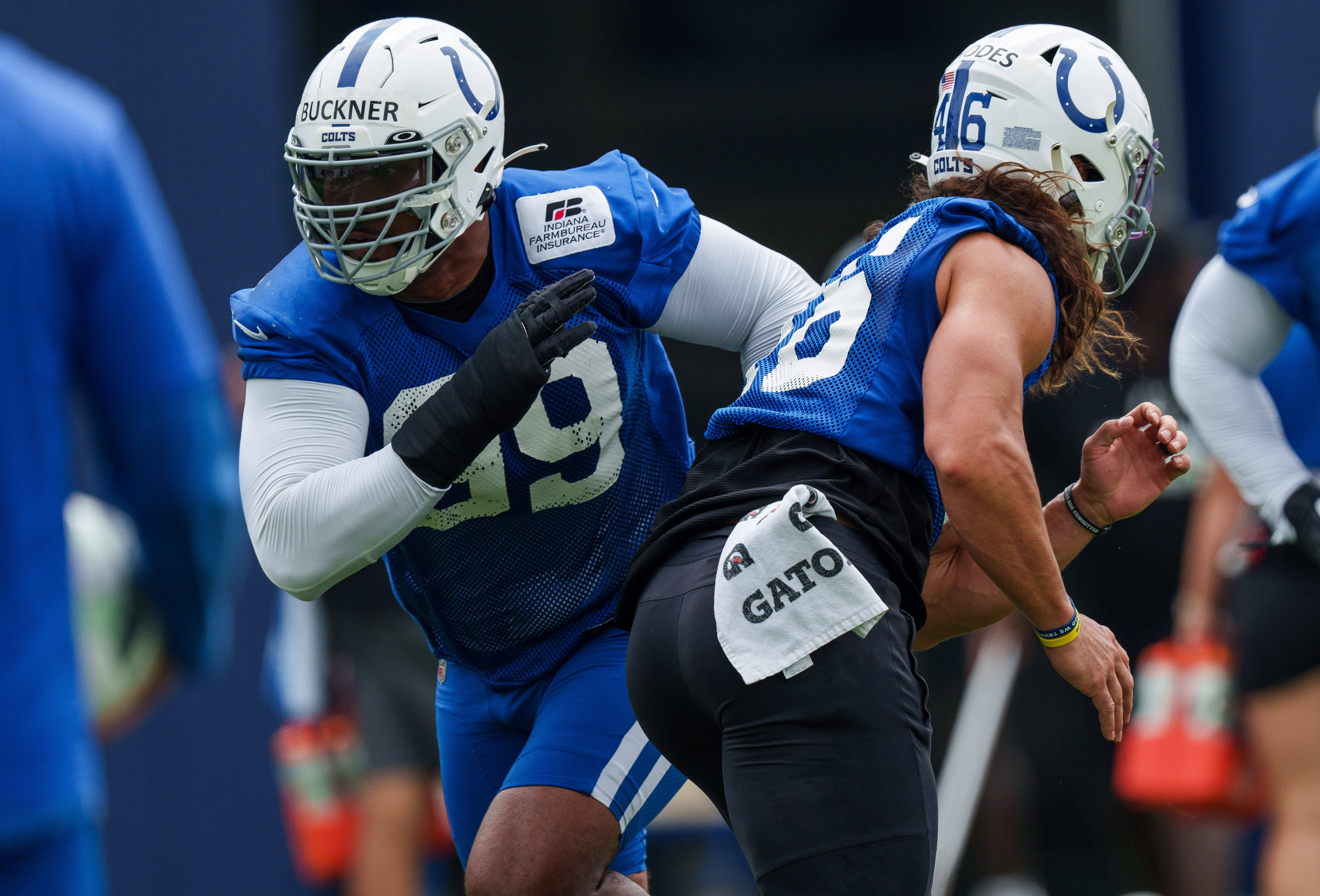 June 14, 2023; Indianapolis, IN, USA; Indianapolis Colts defensive tackle DeForest Buckner (99) works past Colts long snapper Luke Rhodes (46) during special team drills Wednesday, June 14, 2023, during mandatory minicamp at the Indiana Farm Bureau Football Center in Indianapolis.