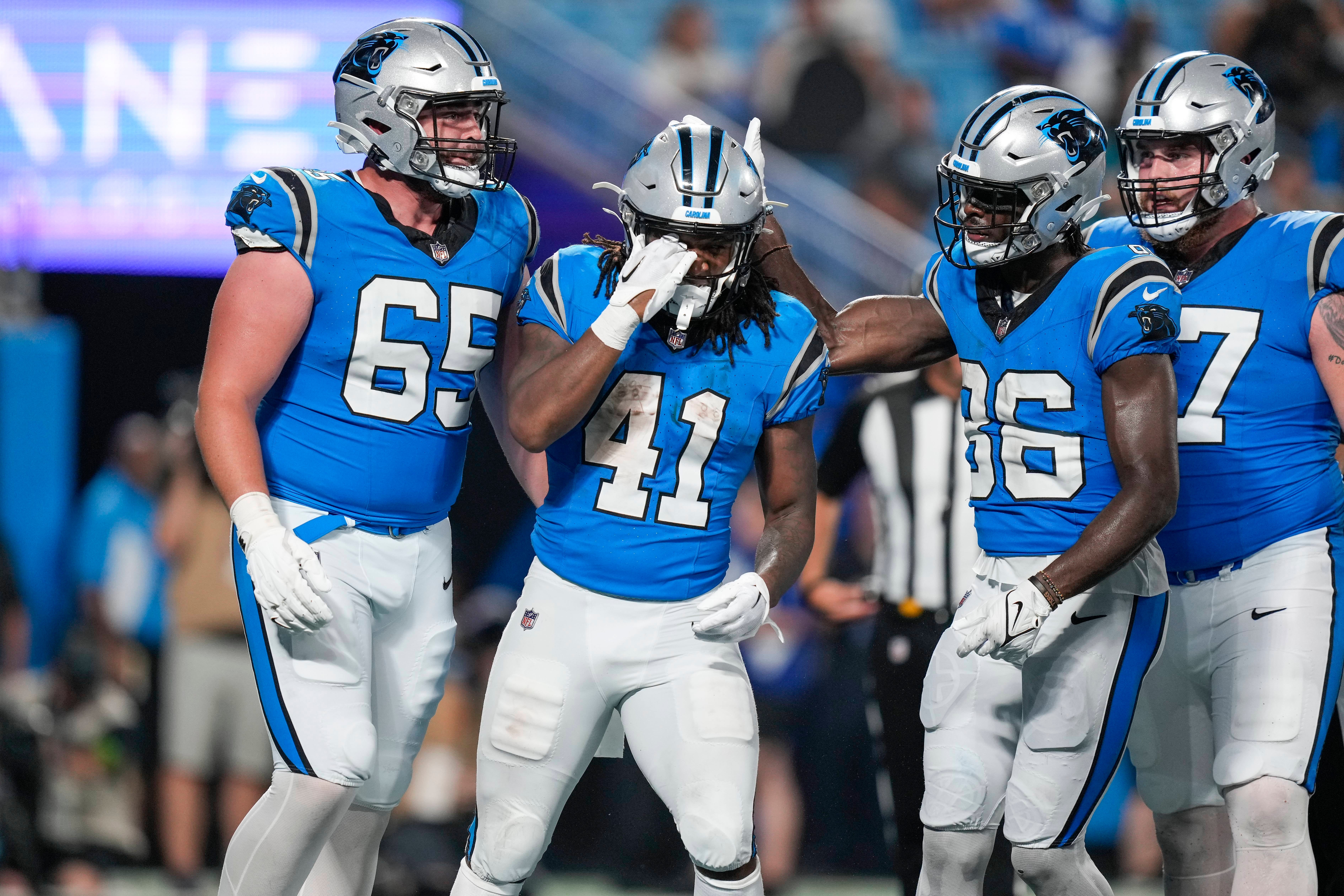 Aug 25, 2023; Charlotte, North Carolina, USA; Carolina Panthers running back Spencer Brown (41) celebrates his touchdown with teammates during the second half against the Detroit Lions at Bank of America Stadium. Mandatory Credit: Jim Dedmon-USA TODAY Sports