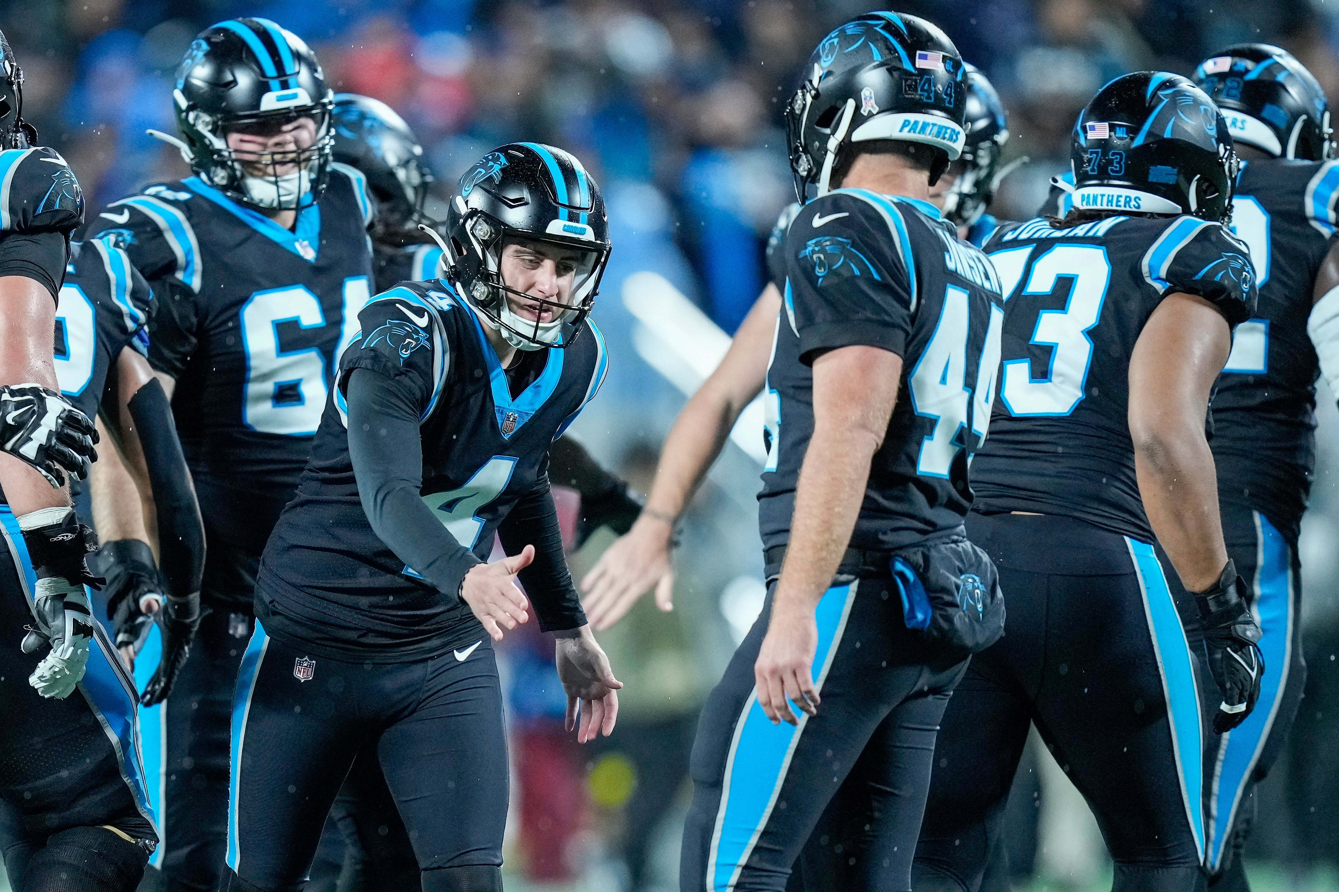 Nov 10, 2022; Charlotte, North Carolina, USA; Carolina Panthers place kicker Eddy Pineiro (4) gets a high five from long snapper JJ Jansen (44) after a field goal during the second half against the Atlanta Falcons at Bank of America Stadium. Mandatory Credit: Jim Dedmon-USA TODAY Sports