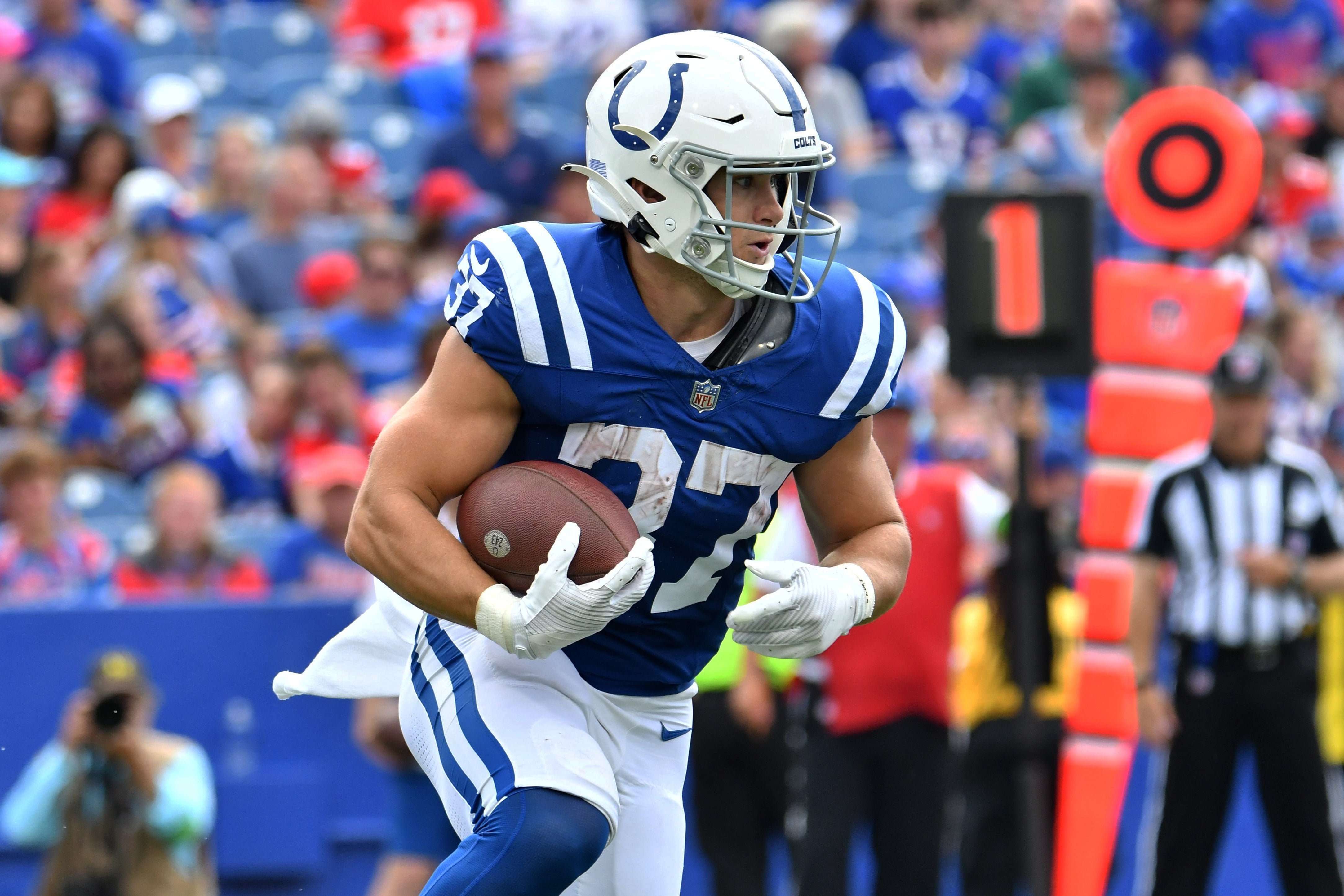 Aug 12, 2023; Orchard Park, New York, USA; Indianapolis Colts running back Jake Funk (37) runs the ball against the Buffalo Bills in the third quarter of a pre-season game at Highmark Stadium.