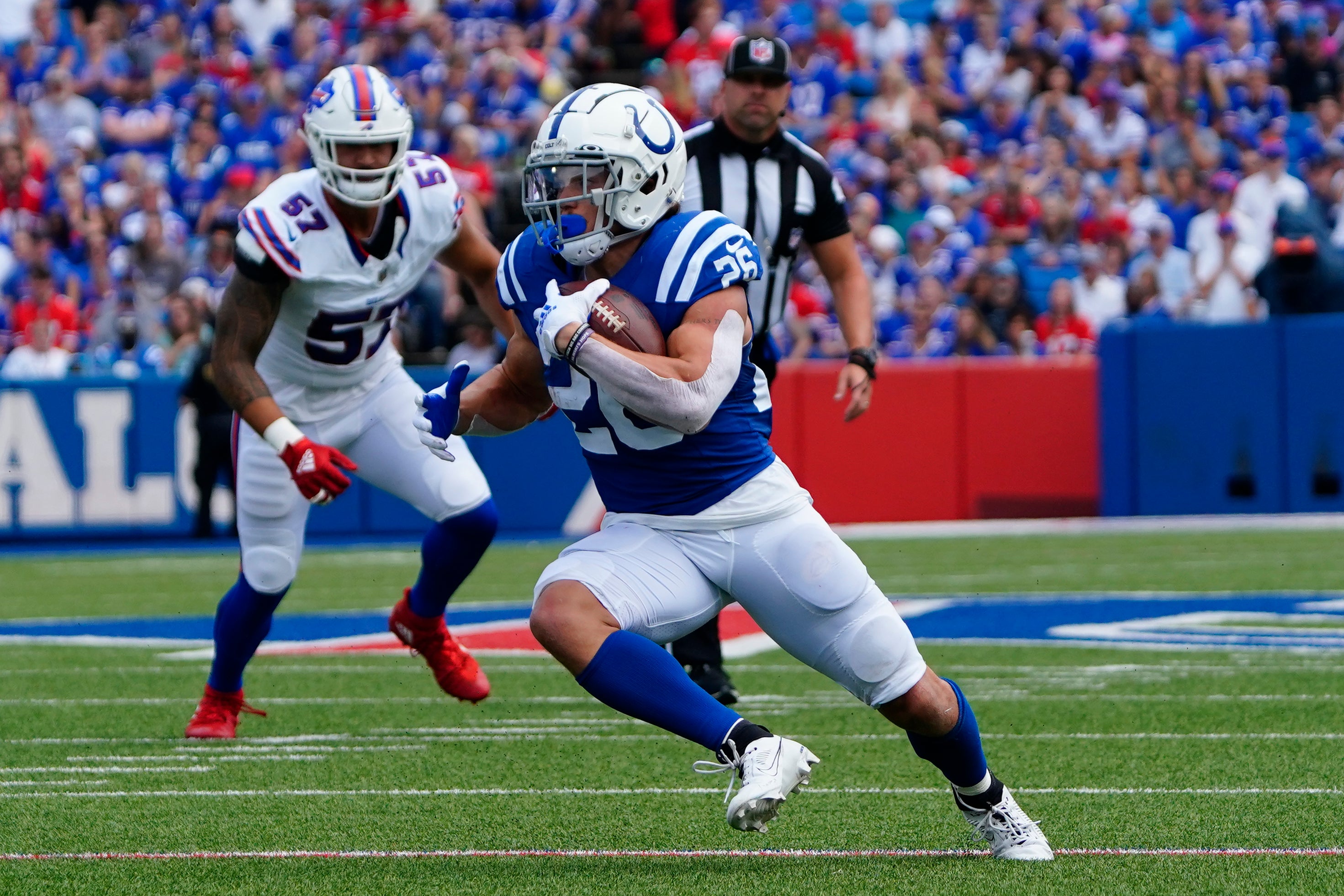Aug 12, 2023; Orchard Park, New York, USA; Indianapolis Colts running back Evan Hull (26) runs with the ball after making a catch against the Buffalo Bills during the first half at Highmark Stadium.