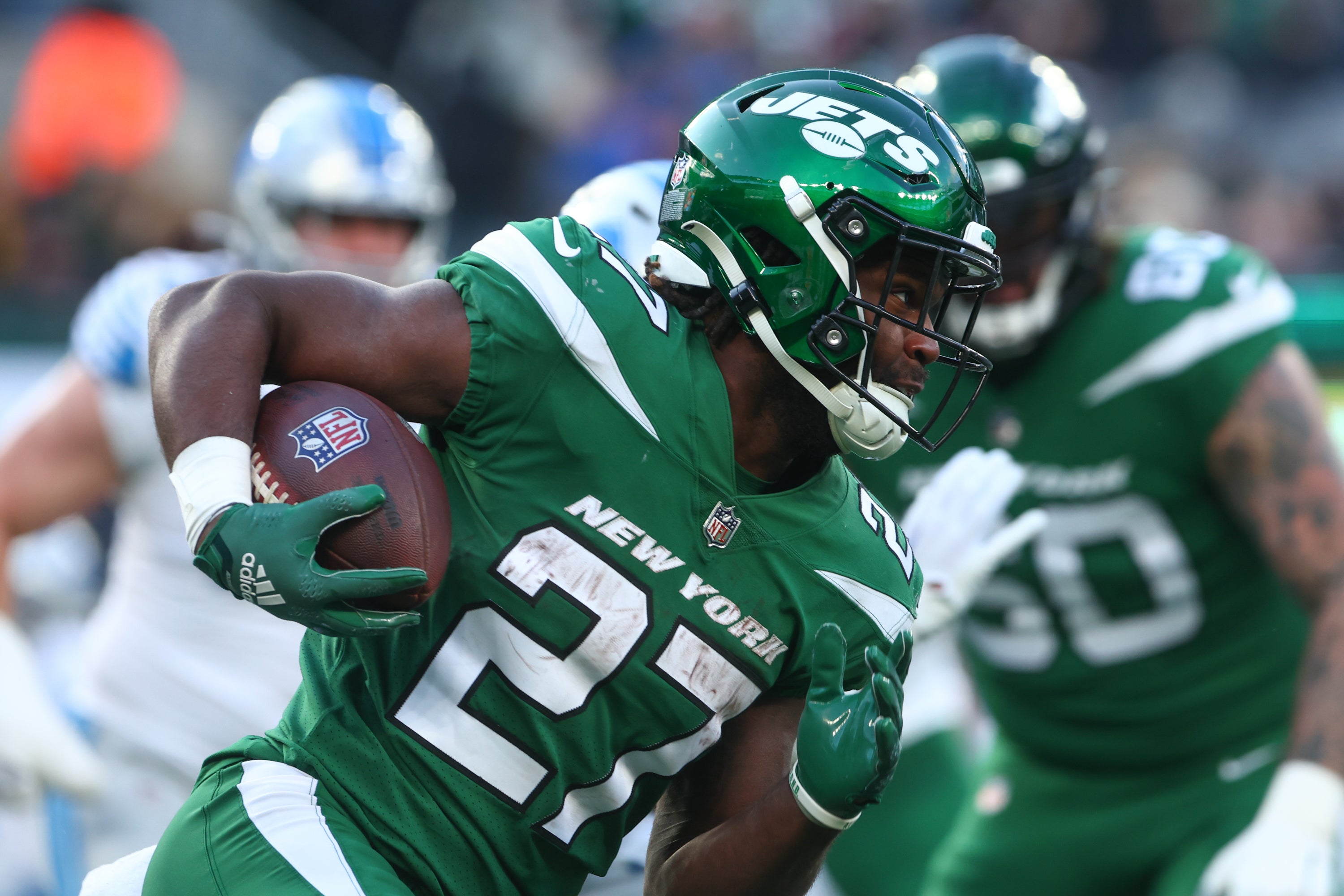 Dec 18, 2022; East Rutherford, New Jersey, USA; New York Jets running back Zonovan Knight (27) runs with the ball against the Detroit Lions during the second half at MetLife Stadium.