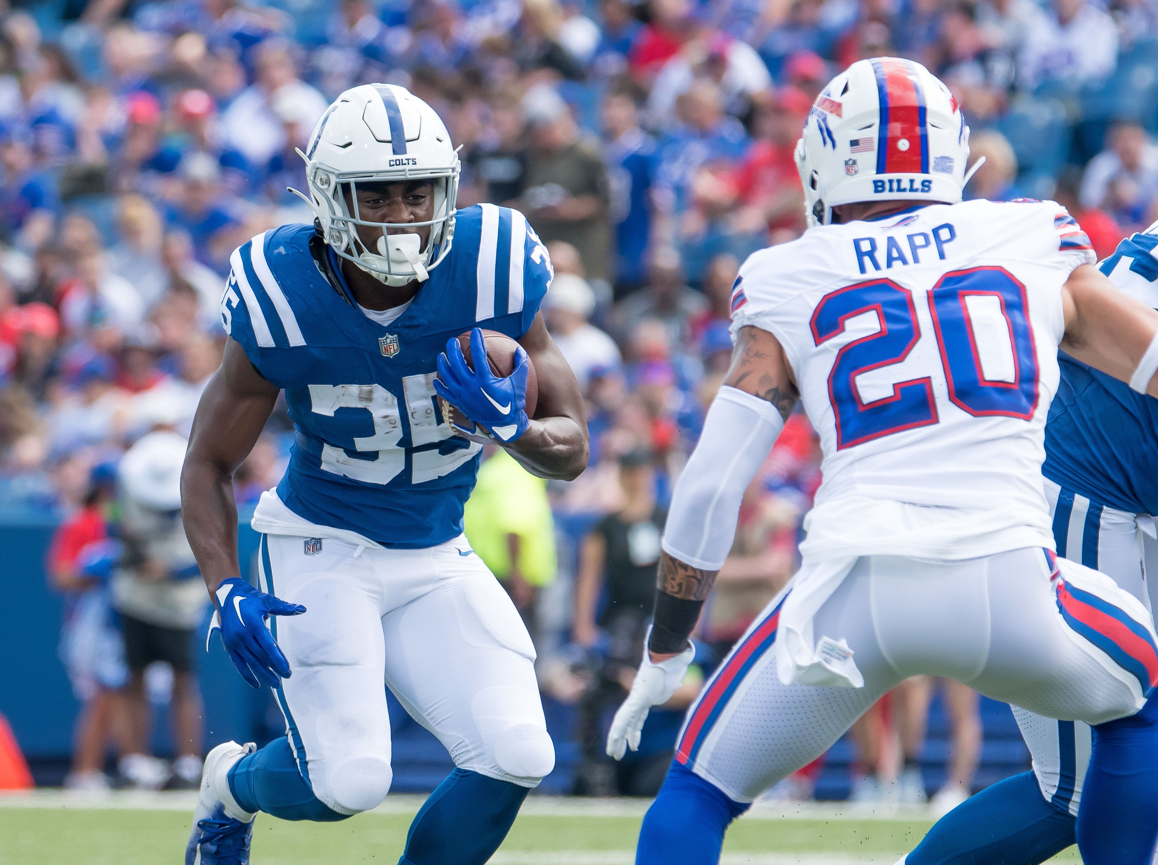 Aug 12, 2023; Orchard Park, New York, USA; Indianapolis Colts running back Deon Jackson (35) against Buffalo Bills safety Taylor Rapp (20) in the first quarter of a pre-season game at Highmark Stadium.
