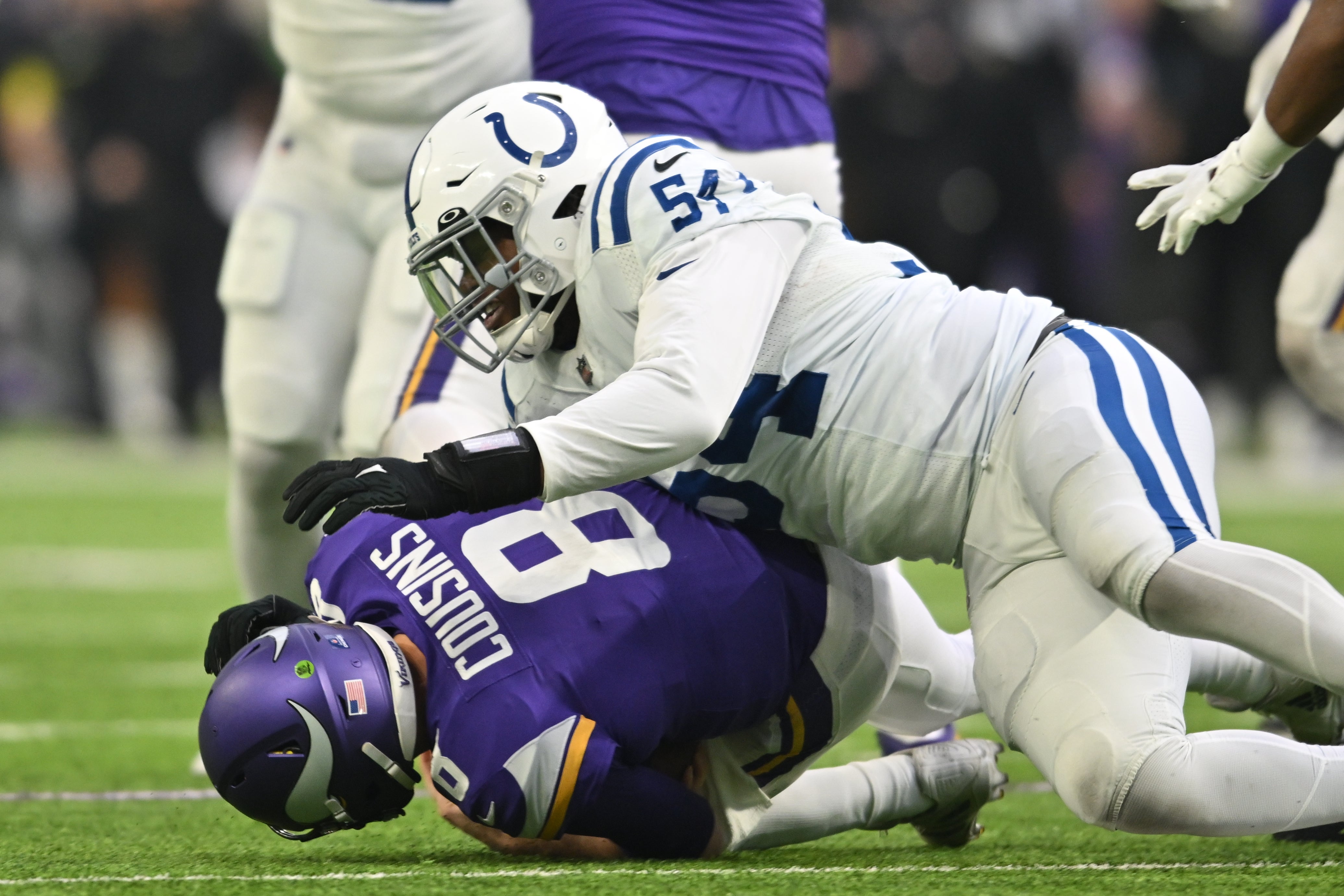 Dec 17, 2022; Minneapolis, Minnesota, USA; Indianapolis Colts defensive end Dayo Odeyingbo (54) sacks Minnesota Vikings quarterback Kirk Cousins (8) during the second quarter at U.S. Bank Stadium.