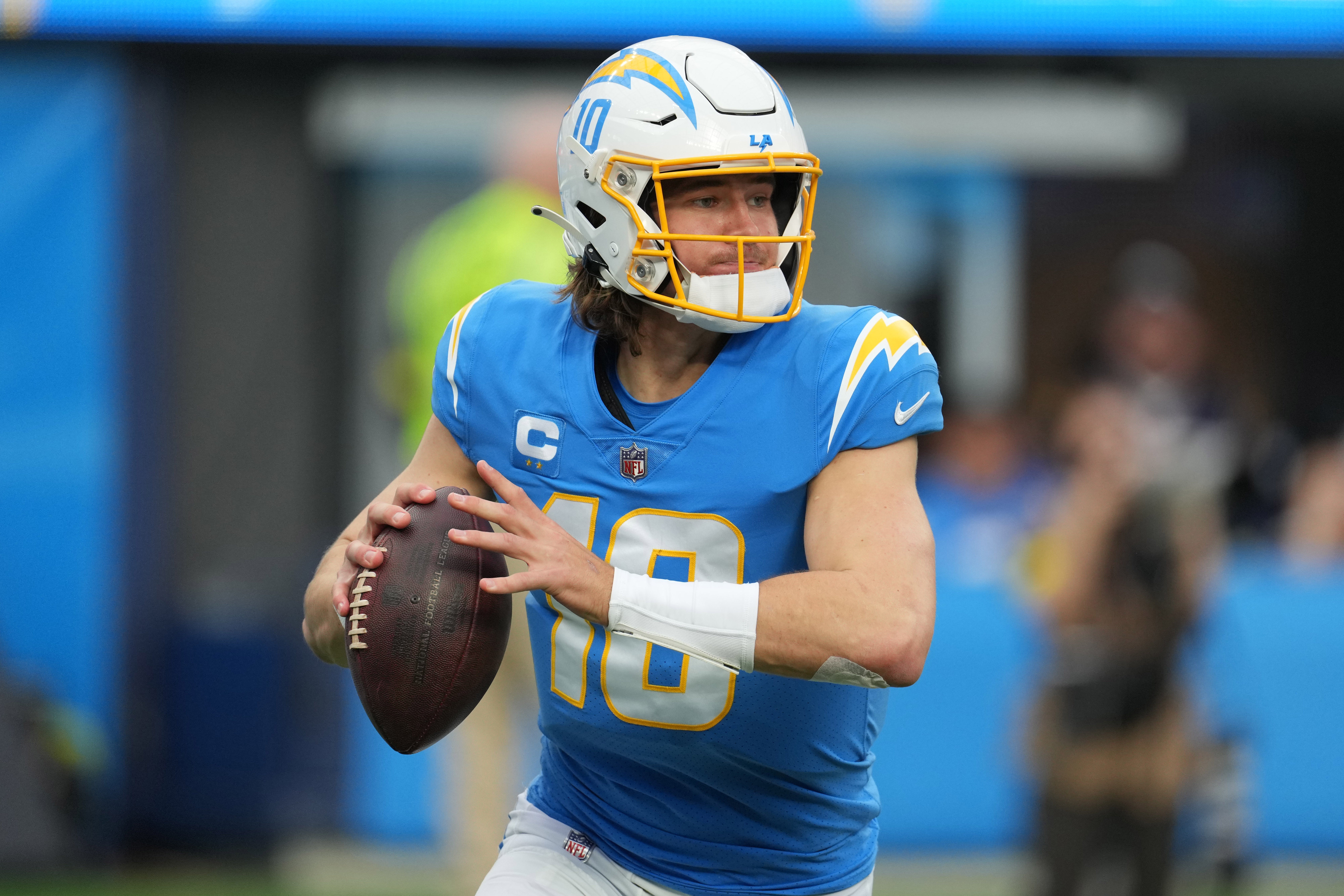 Jan 1, 2023; Inglewood, California, USA; Los Angeles Chargers quarterback Justin Herbert (10) looks to throw the ball in the first half against the Los Angeles Rams at SoFi Stadium.