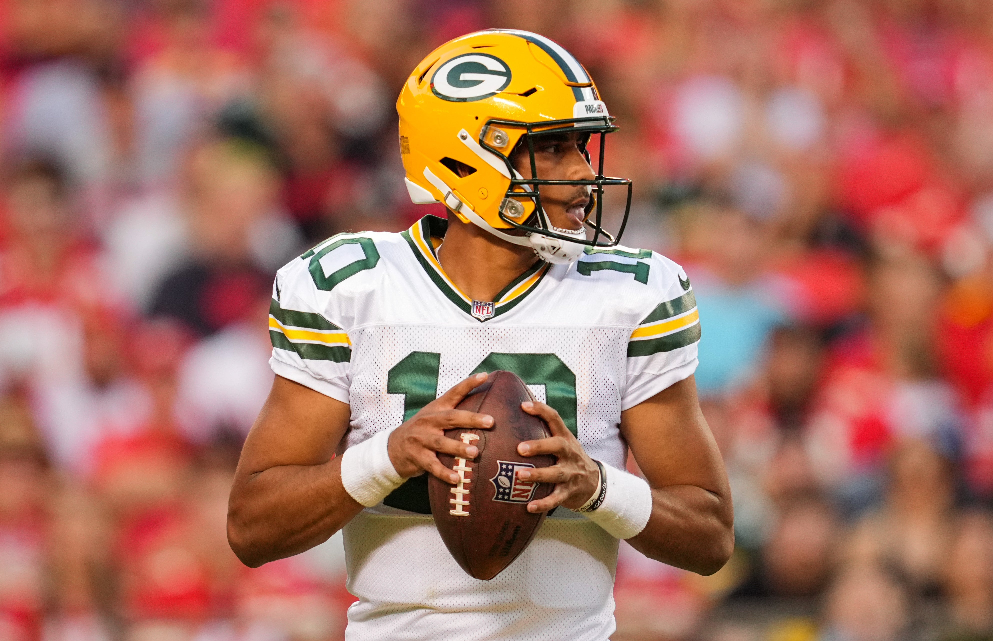 Aug 25, 2022; Kansas City, Missouri, USA; Green Bay Packers quarterback Jordan Love (10) drops back to pass against the Kansas City Chiefs during the first half at GEHA Field at Arrowhead Stadium.