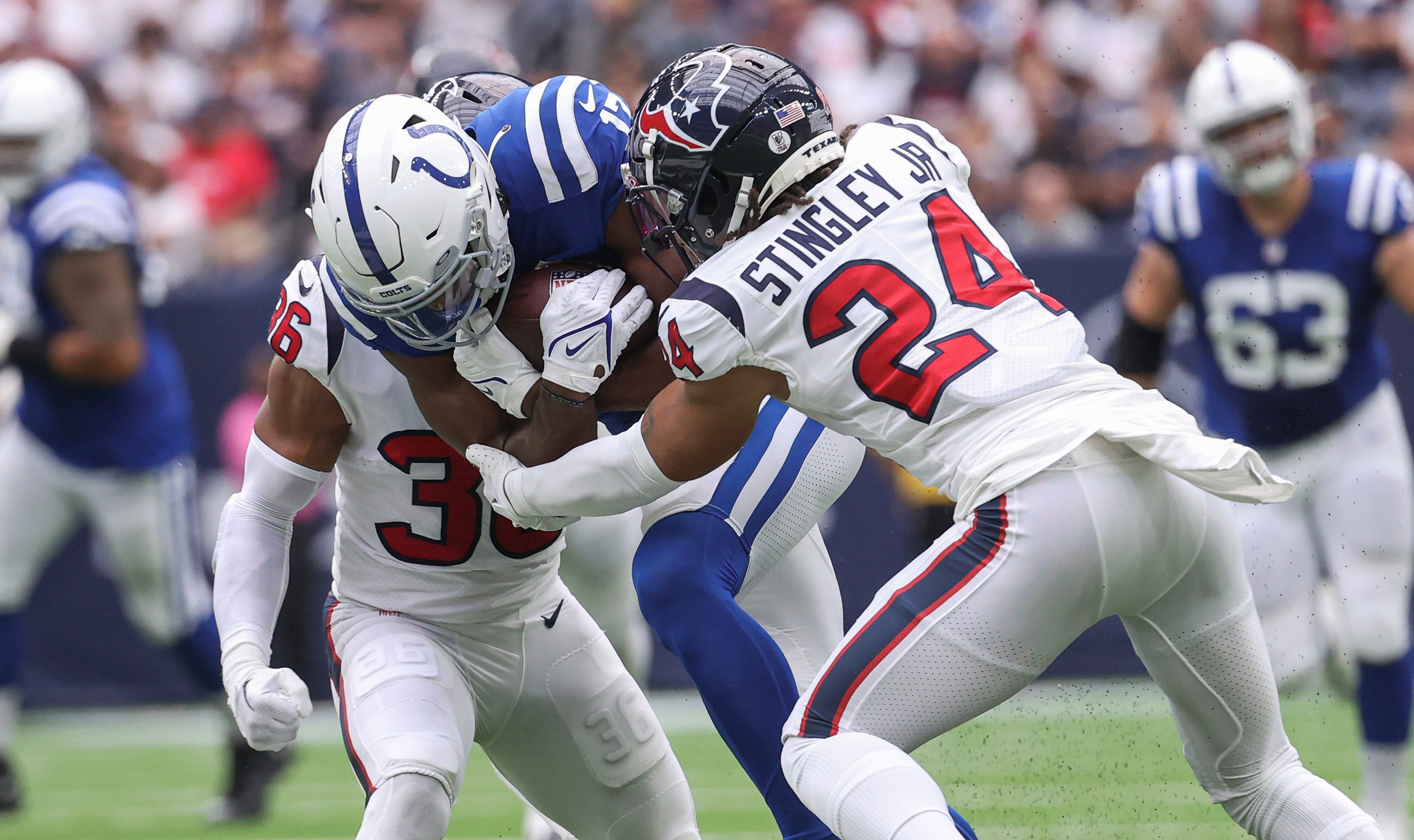 Sep 11, 2022; Houston, Texas, USA; Houston Texans cornerback Derek Stingley Jr. (24) attempts to make a tackle on Indianapolis Colts wide receiver Mike Strachan (17) during the first quarter at NRG Stadium.