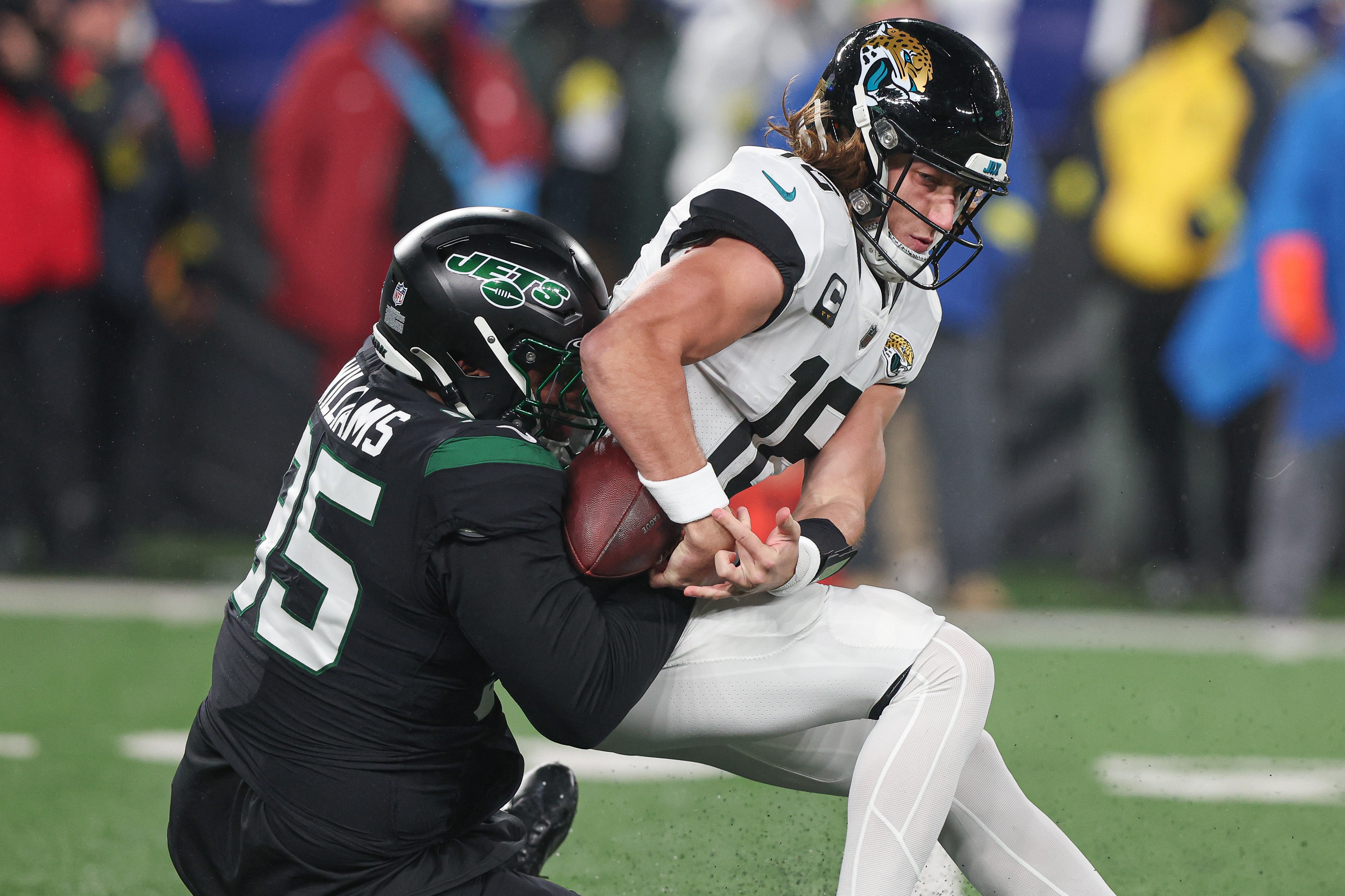 Jacksonville Jaguars quarterback Trevor Lawrence (16) is sacked by New York Jets defensive tackle Quinnen Williams (95) forcing a fumble during the first half at MetLife Stadium. Mandatory Credit: Vincent Carchietta-USA TODAY Sports