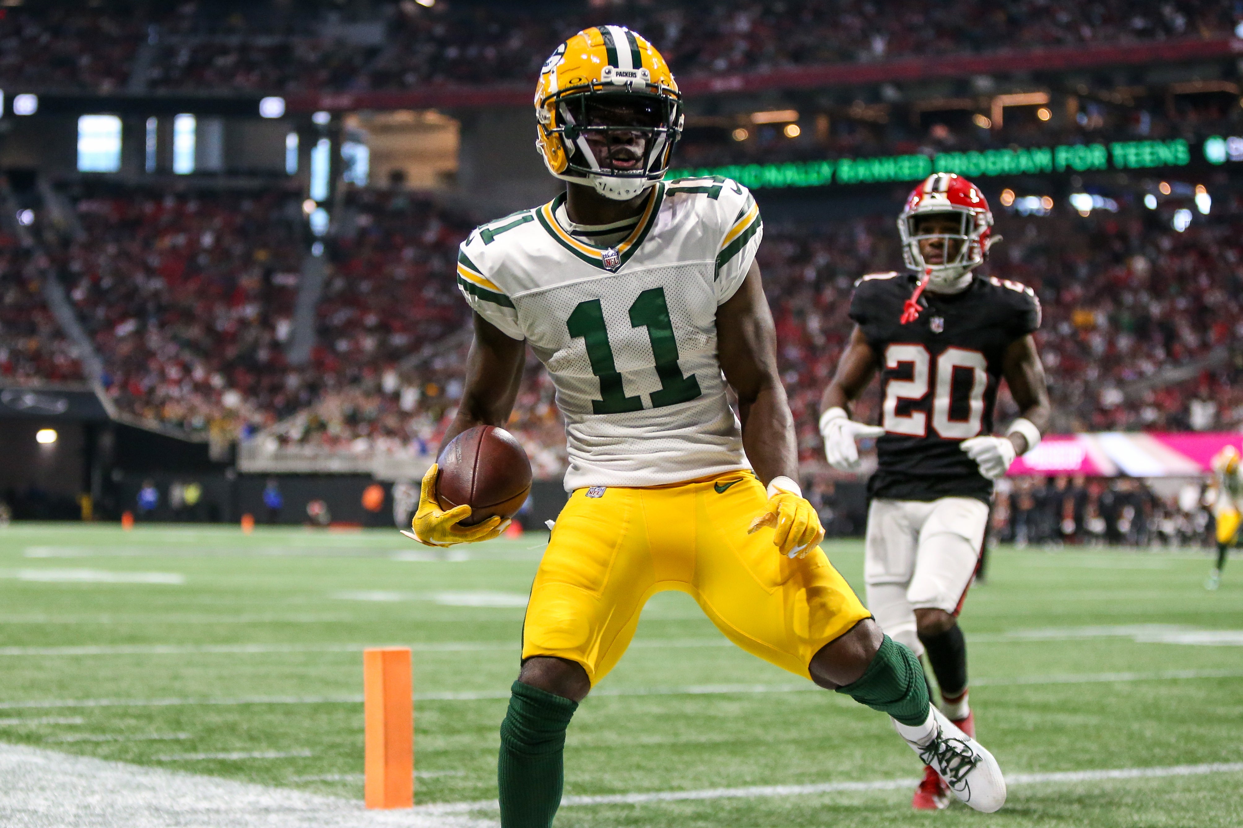 Sep 17, 2023; Atlanta, Georgia, USA; Green Bay Packers wide receiver Jayden Reed (11) scores a touchdown against the Atlanta Falcons in the second half at Mercedes-Benz Stadium. Brett Davis-USA TODAY Sports
