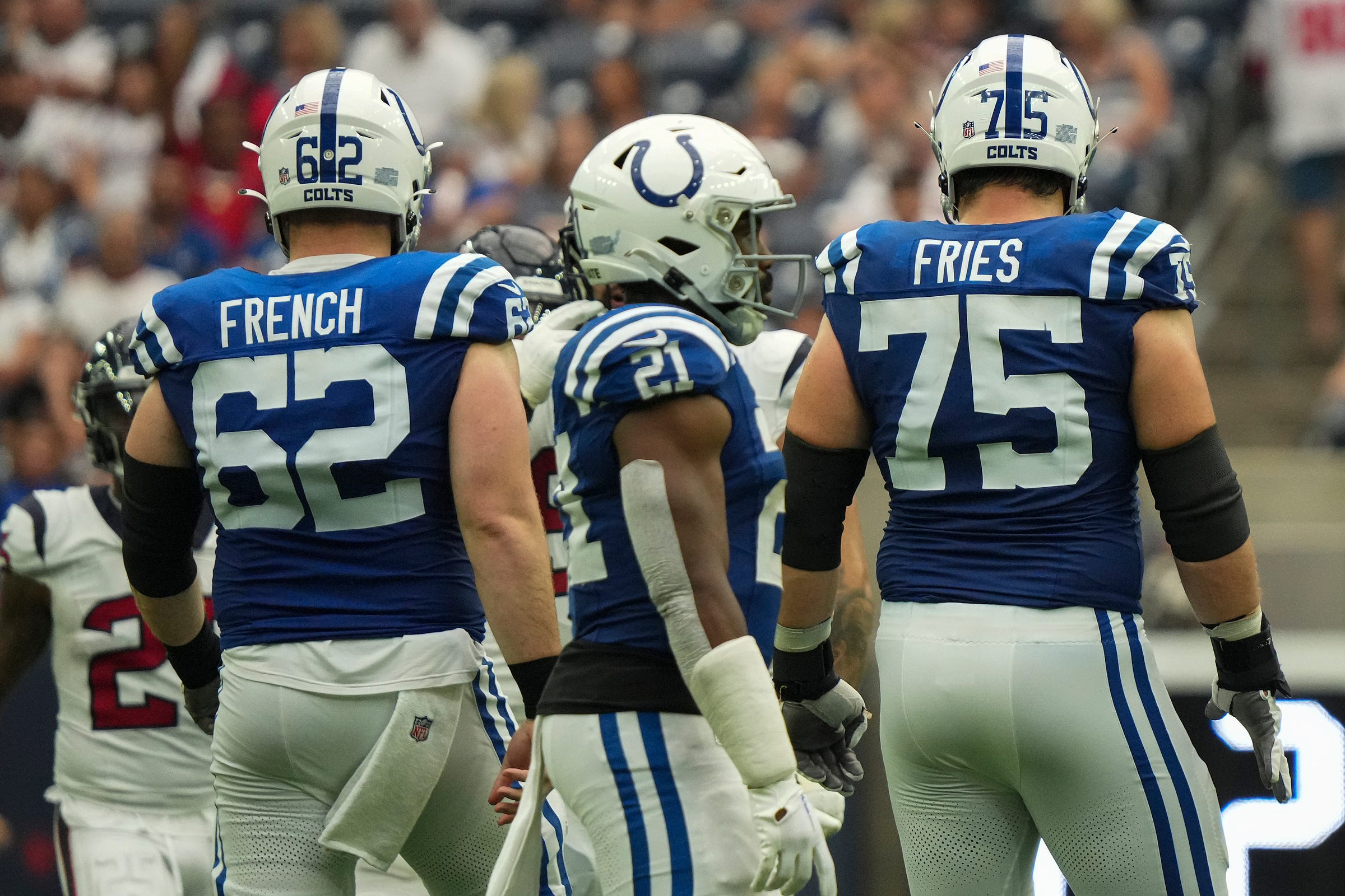 Indianapolis Colts center Wesley French (62) and guard Will Fries (75) stand next to each other before beginning an offensive play Sunday, Sept. 17, 2023, during a game against the Houston Texans at NRG Stadium in Houston.