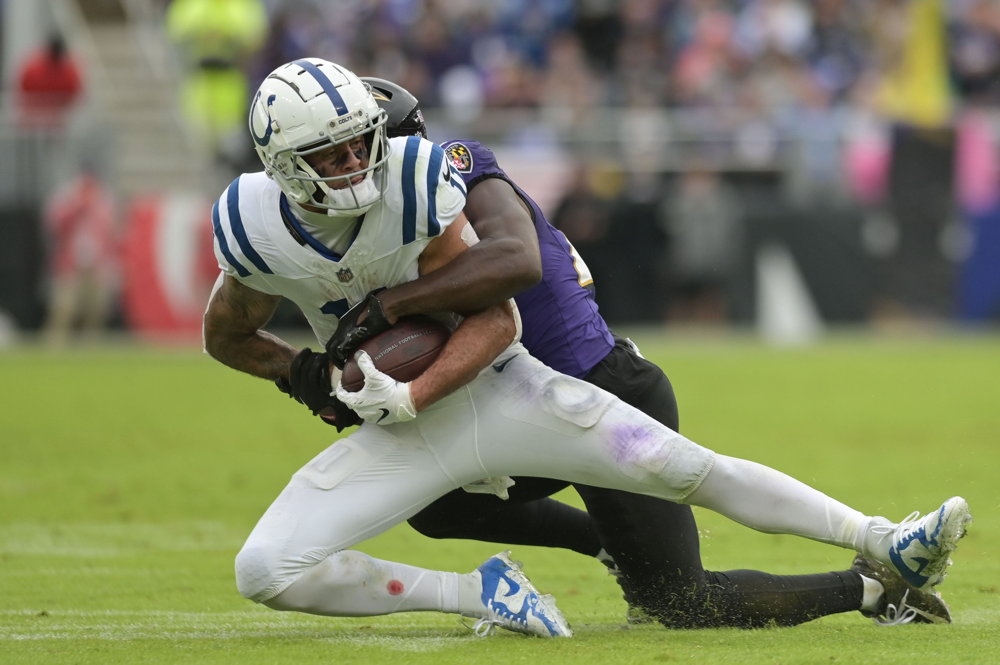 Sep 24, 2023; Baltimore, Maryland, USA; Indianapolis Colts wide receiver Michael Pittman Jr. (11) holds on for first down during the first half against the Baltimore Ravens at M&T Bank Stadium.