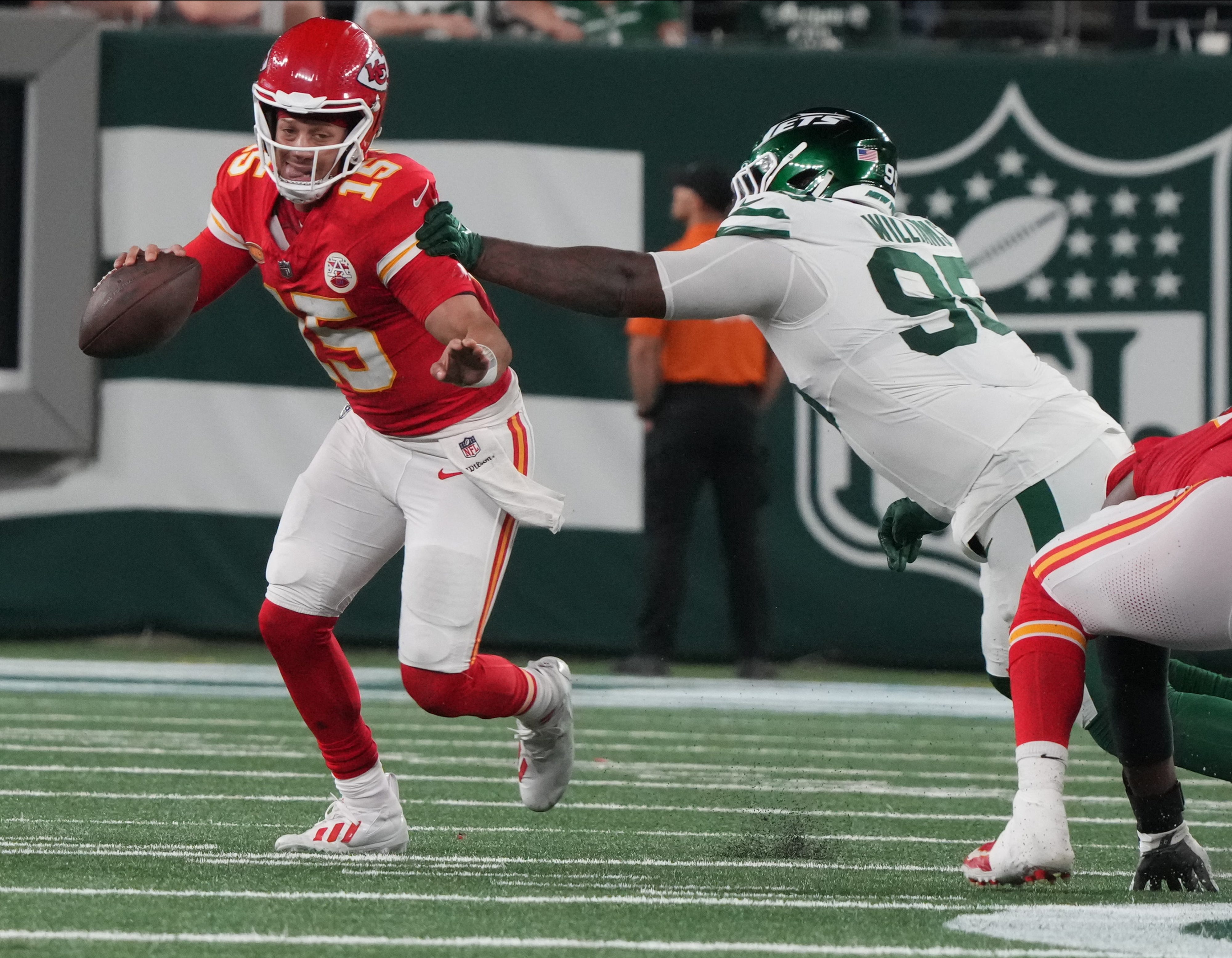 Chiefs quarterback Patrick Mahomes gets out of the grasp of Quinnen Williams of the Jets in the second half. The New York Jets host the Kansas City Chiefs at MetLife Stadium in East Rutherford, NJ on October 1, 2023.