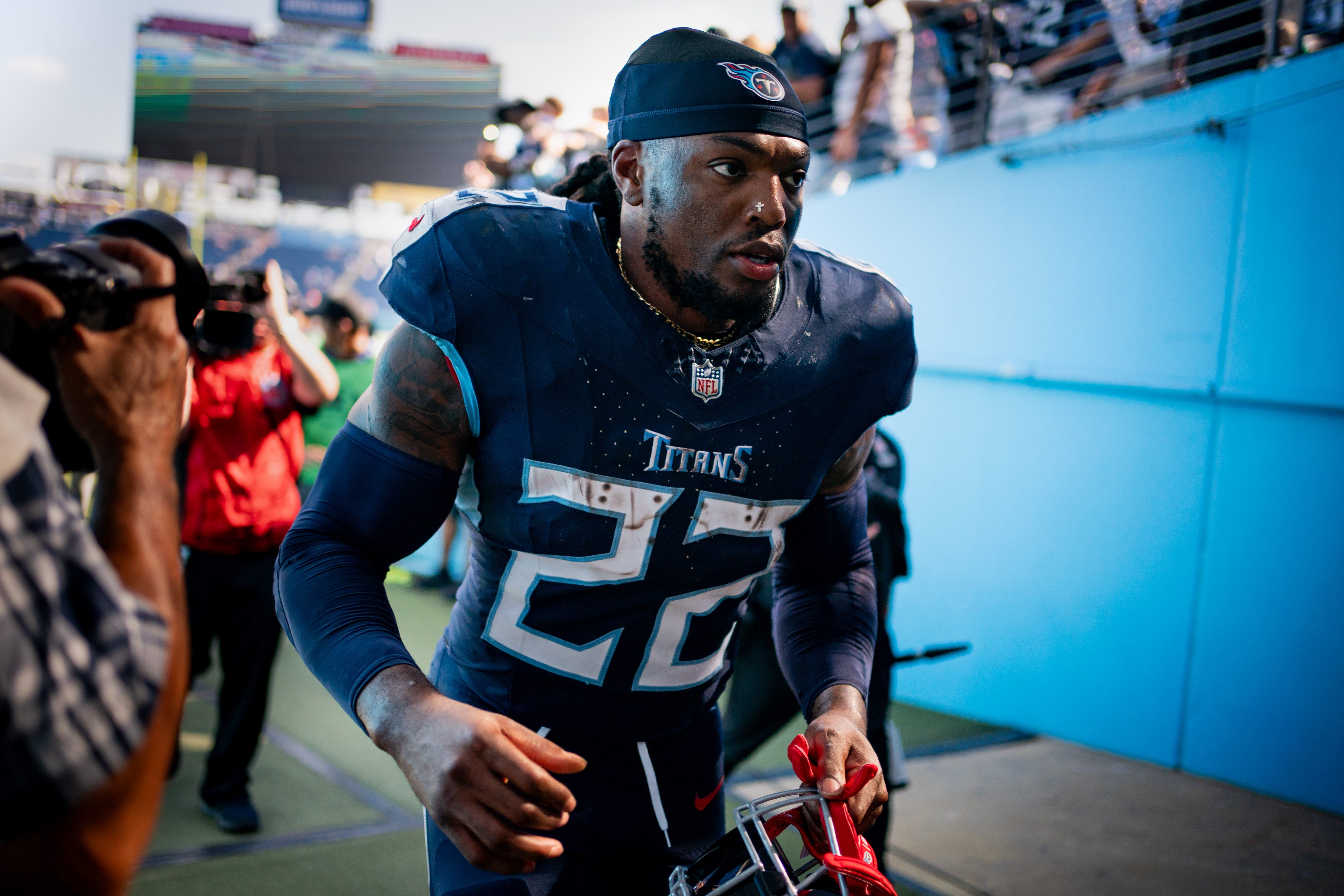 Tennessee Titans running back Derrick Henry (22) heads to the locker room after defeating the Cincinnati Bengals at Nissan Stadium in Nashville, Tenn., Sunday, Oct. 1, 2023.