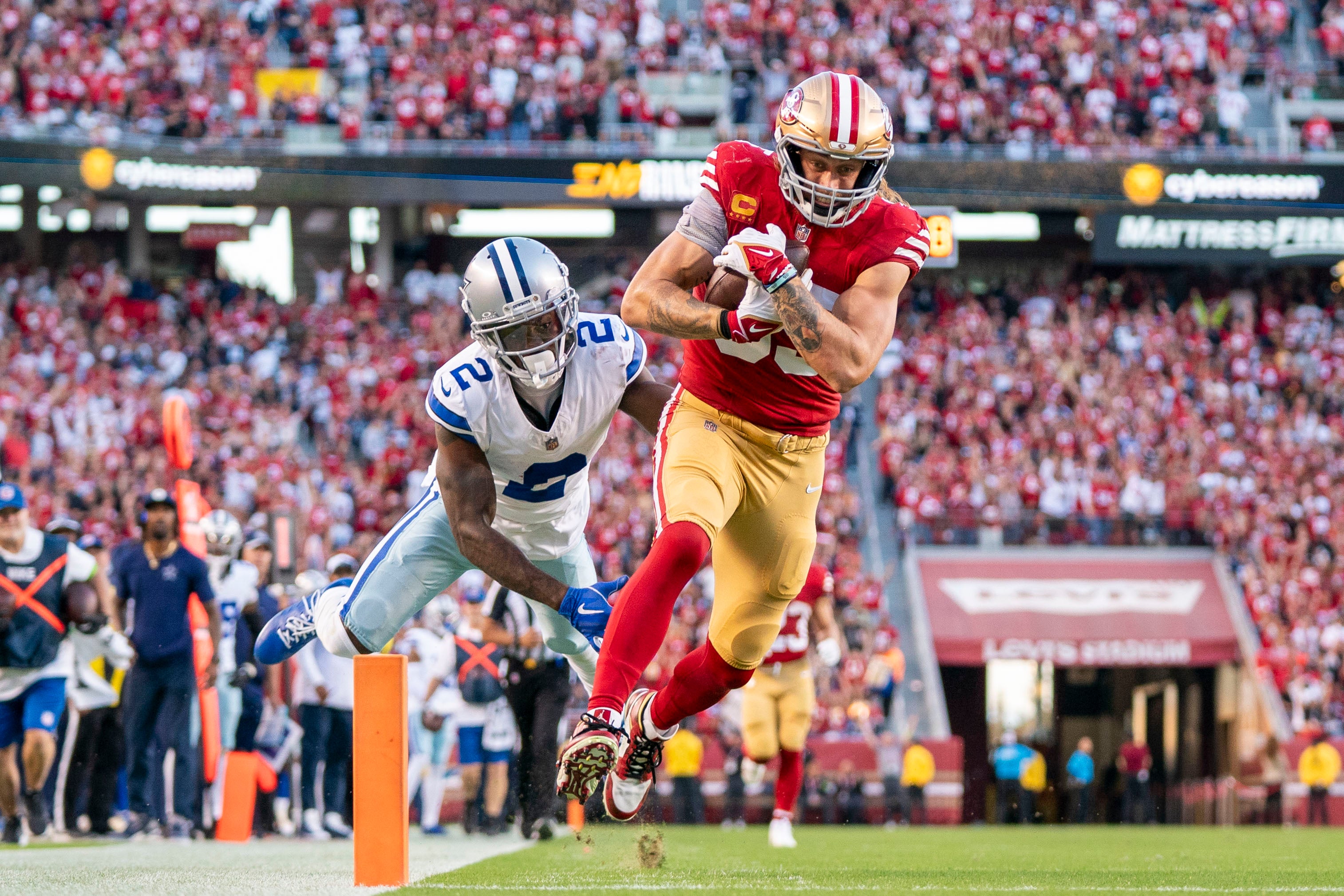 San Francisco 49ers tight end George Kittle (85) scores a touchdown against Dallas Cowboys cornerback Jourdan Lewis (2) during the second quarter at Levi's Stadium. Mandatory Credit: Kyle Terada-USA TODAY Sports