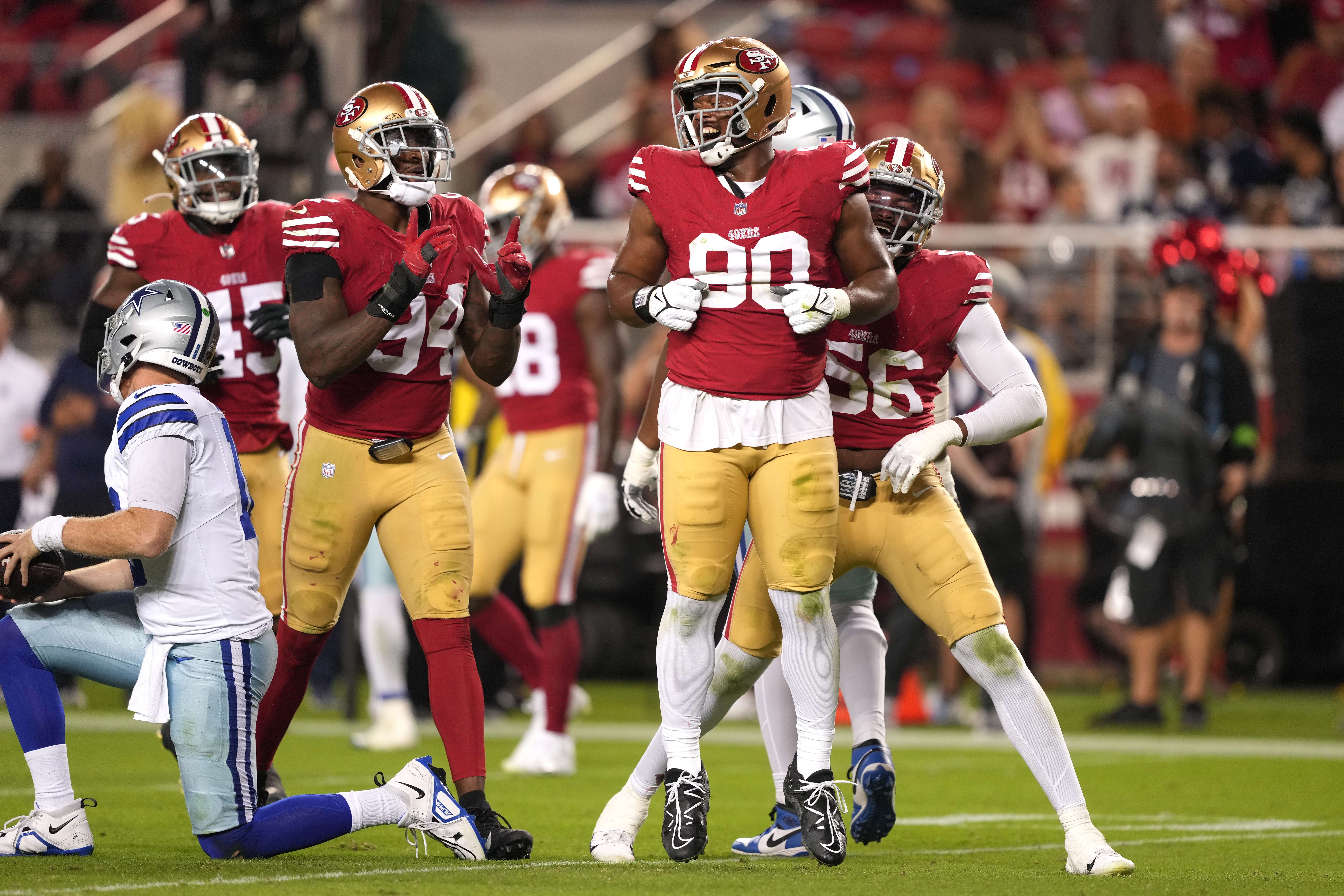 Oct 8, 2023; Santa Clara, California, USA; San Francisco 49ers defensive tackle Kevin Givens (90) reacts after sacking Dallas Cowboys quarterback Cooper Rush (far left) during the fourth quarter at Levi's Stadium.