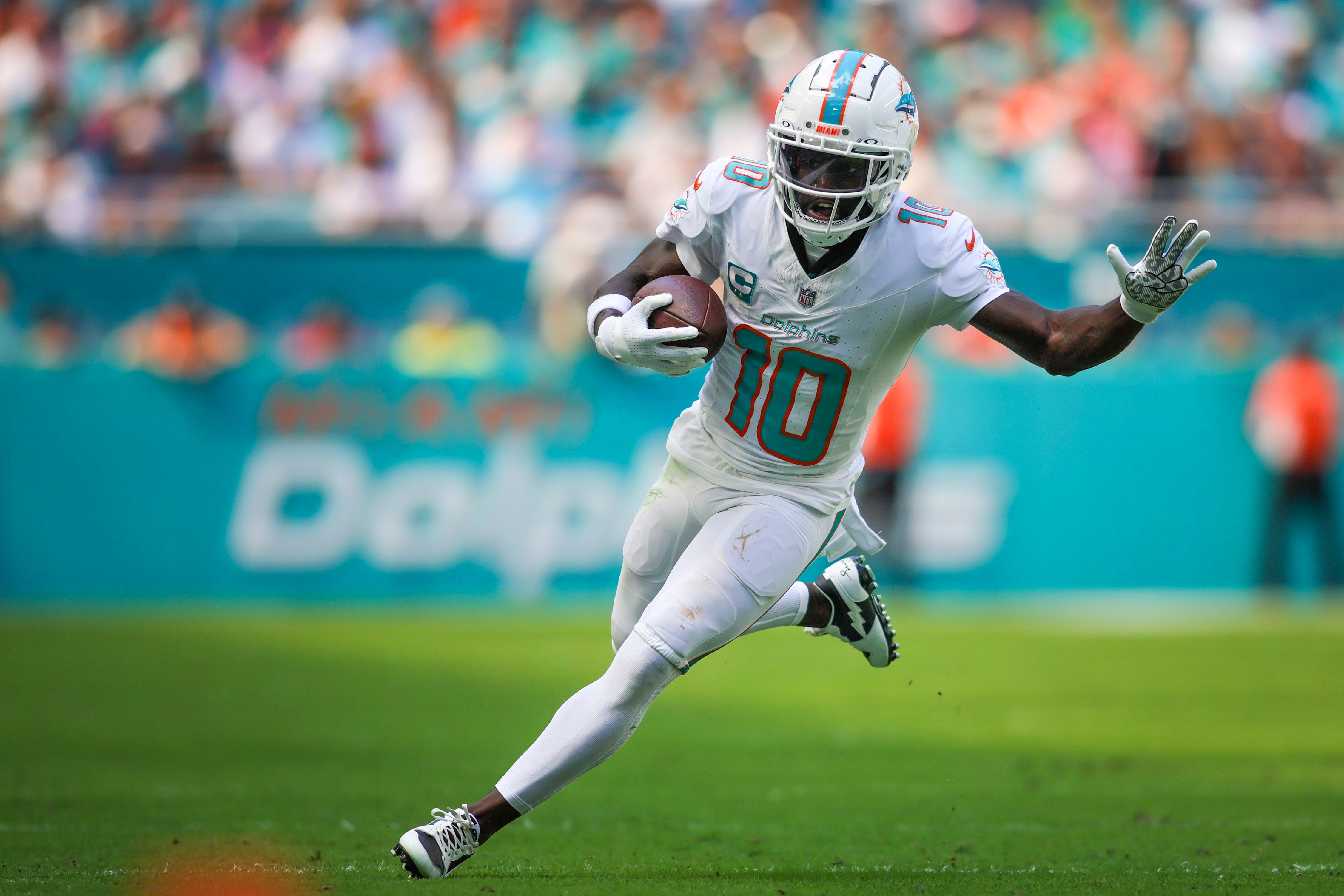 Miami Dolphins wide receiver Tyreek Hill (10) runs with the football against the Carolina Panthers during the second quarter at Hard Rock Stadium. Mandatory Credit: Sam Navarro-USA TODAY Sports